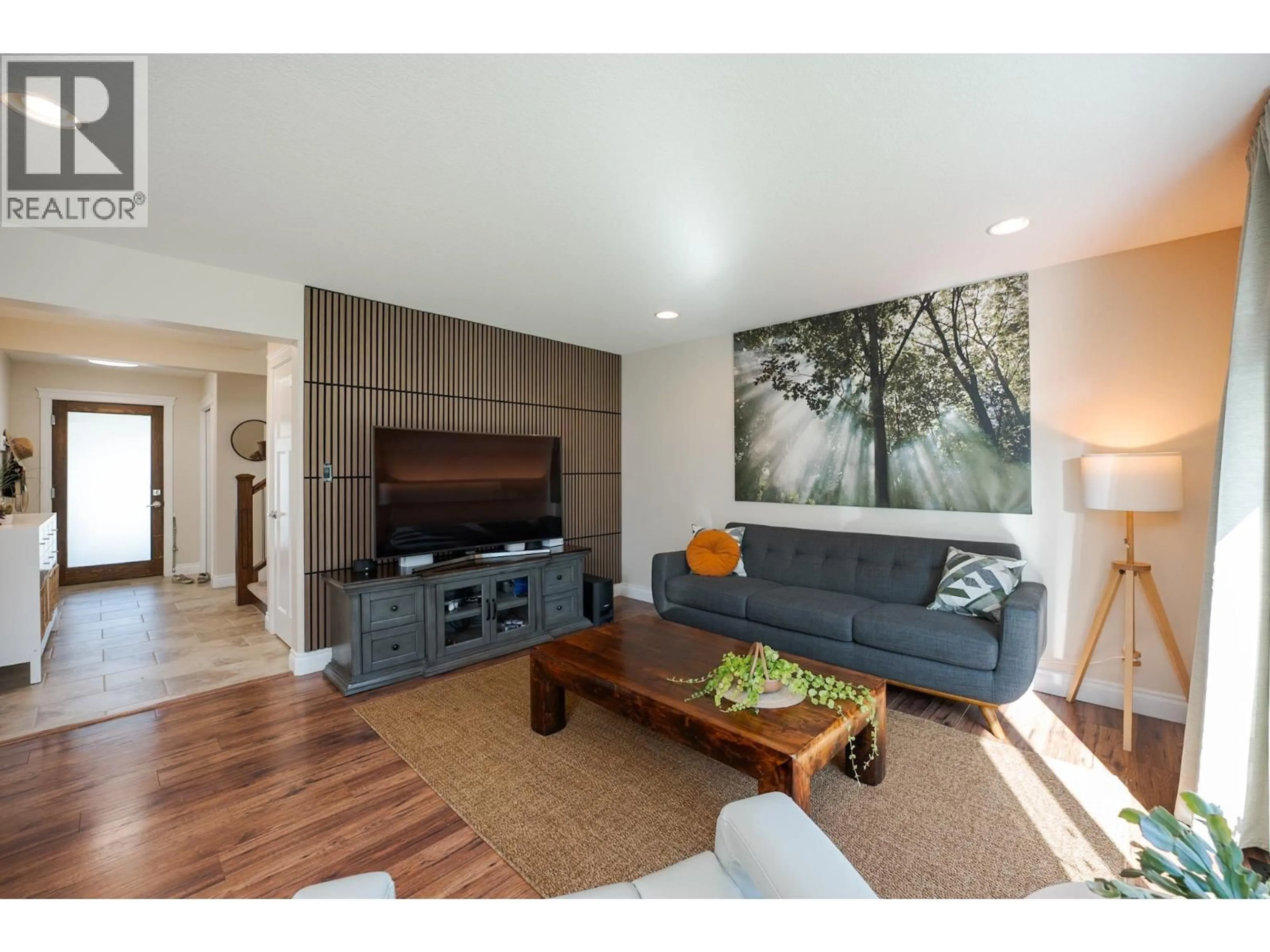 Living room with furniture, wood/laminate floor for 5882 VIRK PLACE, Prince George British Columbia V2N6J1