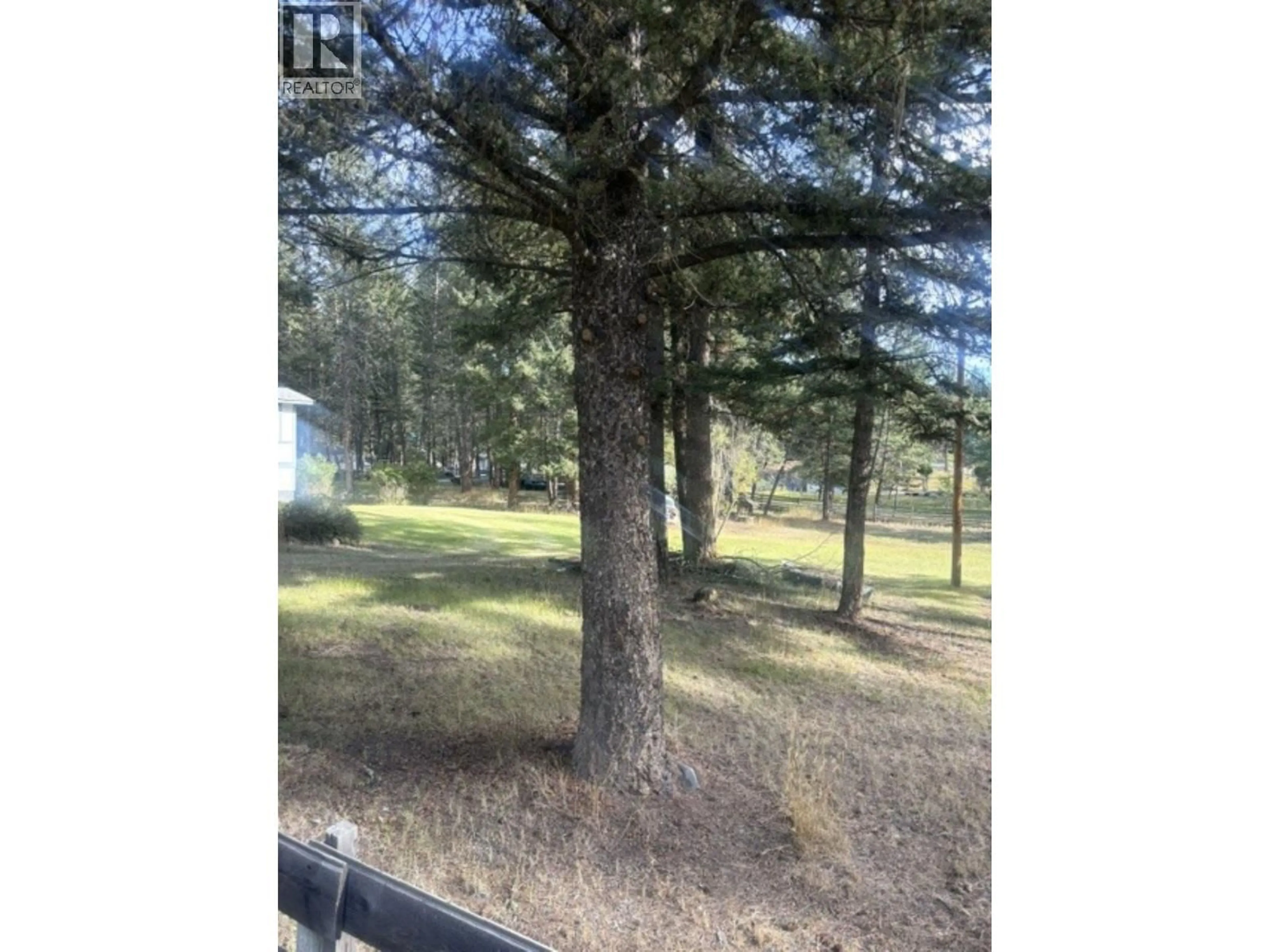 A pic from outside/outdoor area/front of a property/back of a property/a pic from drone, forest/trees view for 5044 EASZEE DRIVE, 108 Mile Ranch British Columbia V0K2Z0