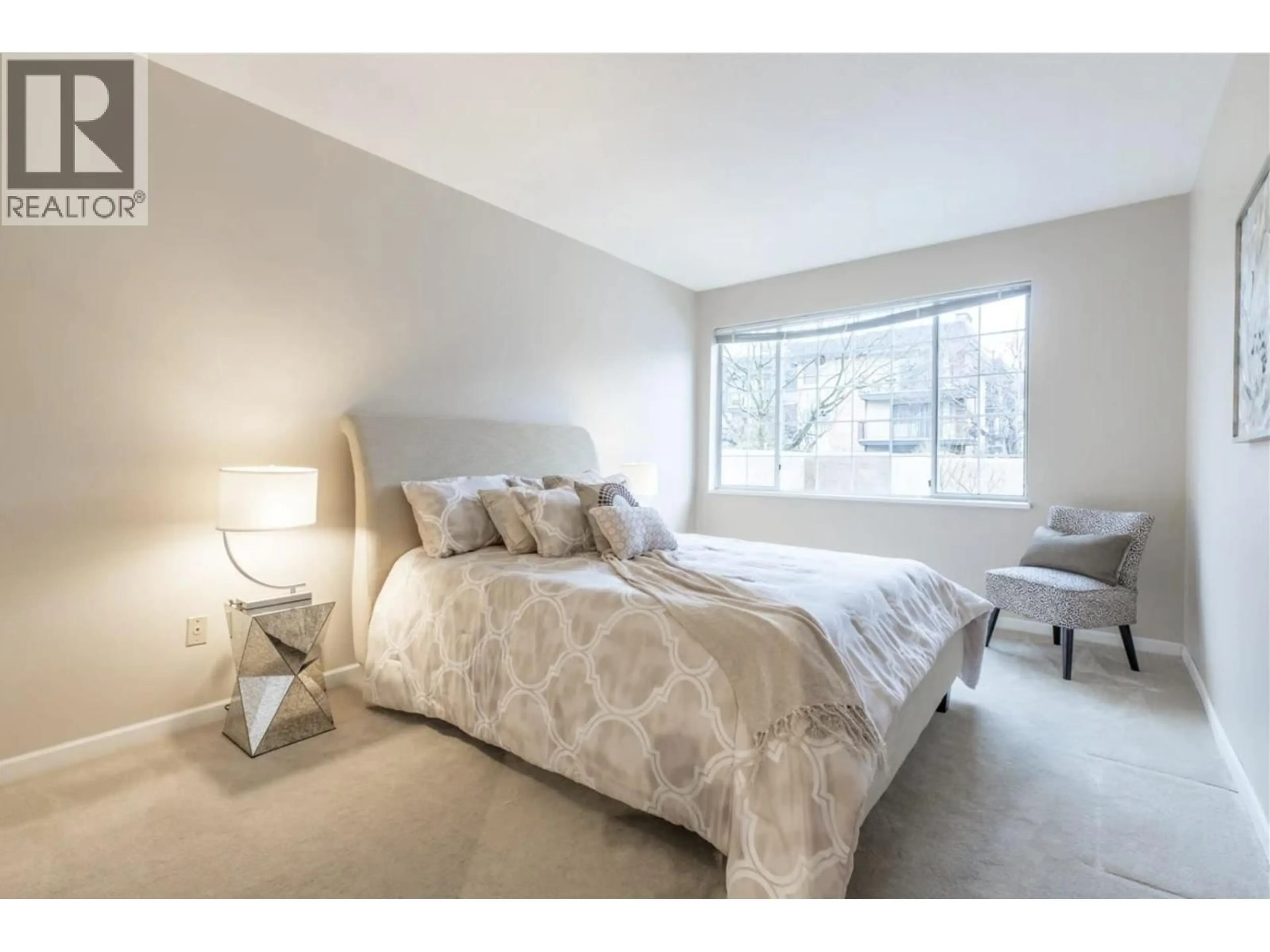 Bedroom with bed, unknown for 106 - 125 18TH STREET, North Vancouver British Columbia V7M1W5