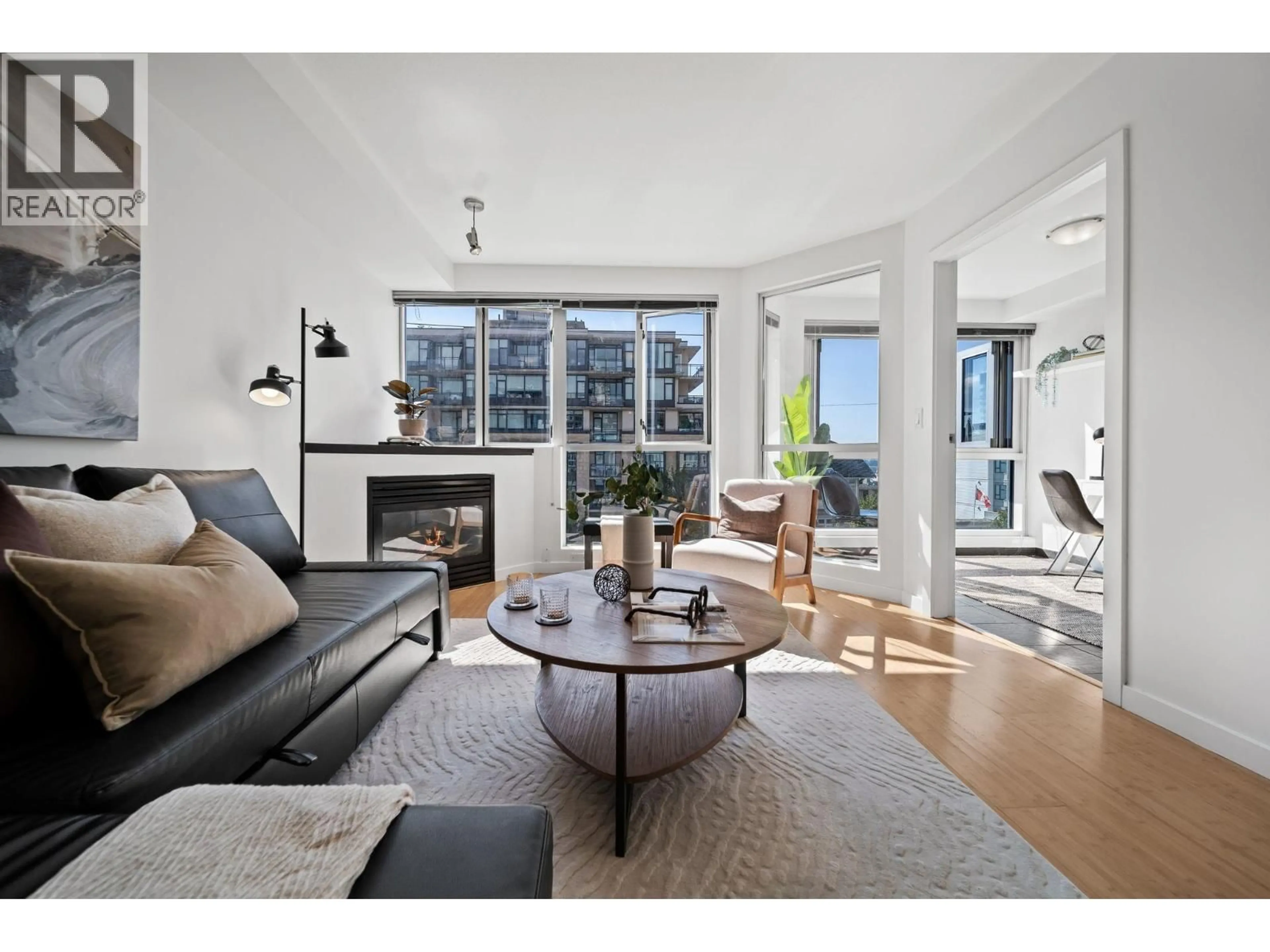 Living room with furniture, wood/laminate floor for 409 - 122 3RD STREET, North Vancouver British Columbia V7L1E6