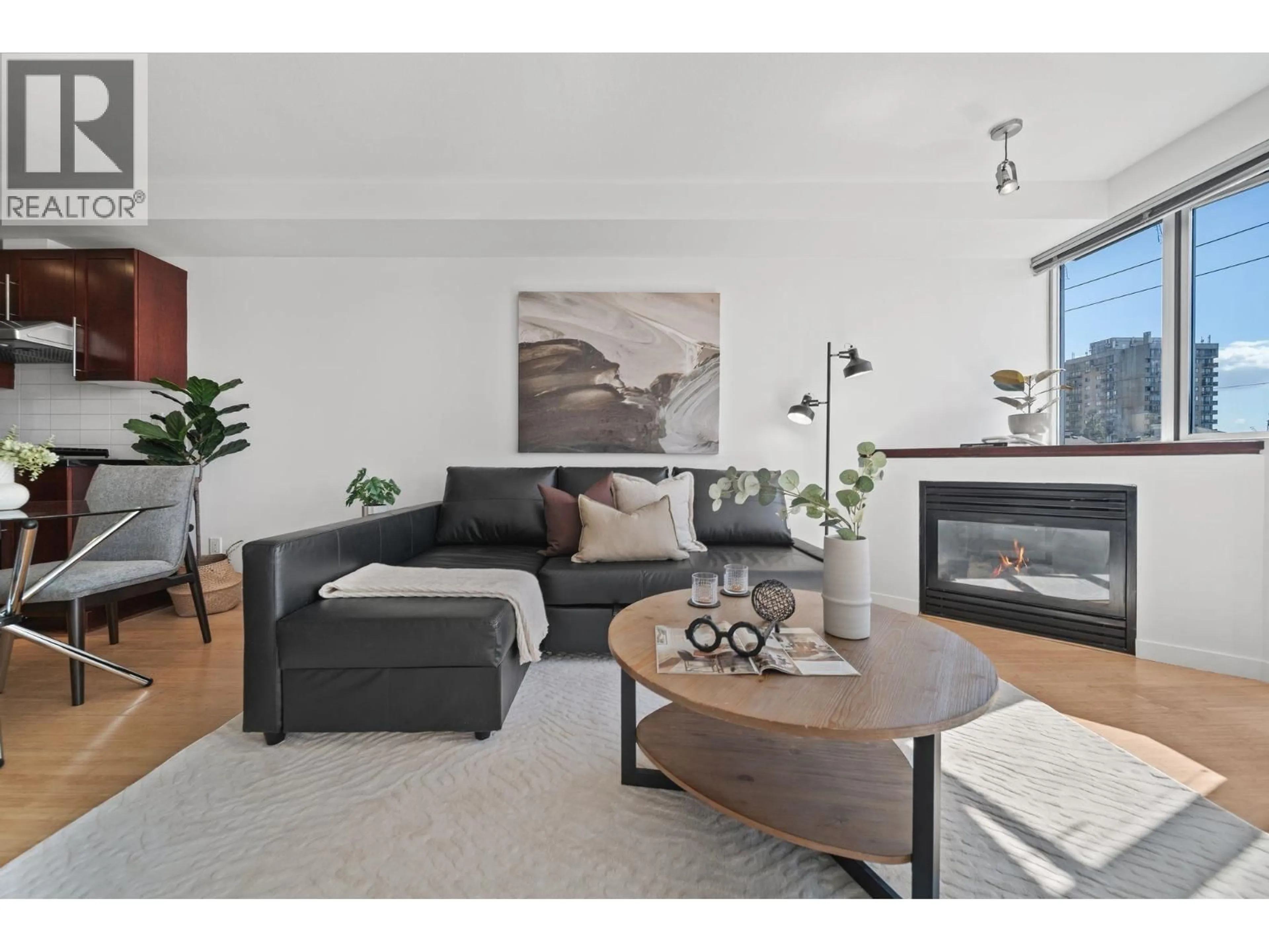 Living room with furniture, wood/laminate floor for 409 - 122 3RD STREET, North Vancouver British Columbia V7L1E6
