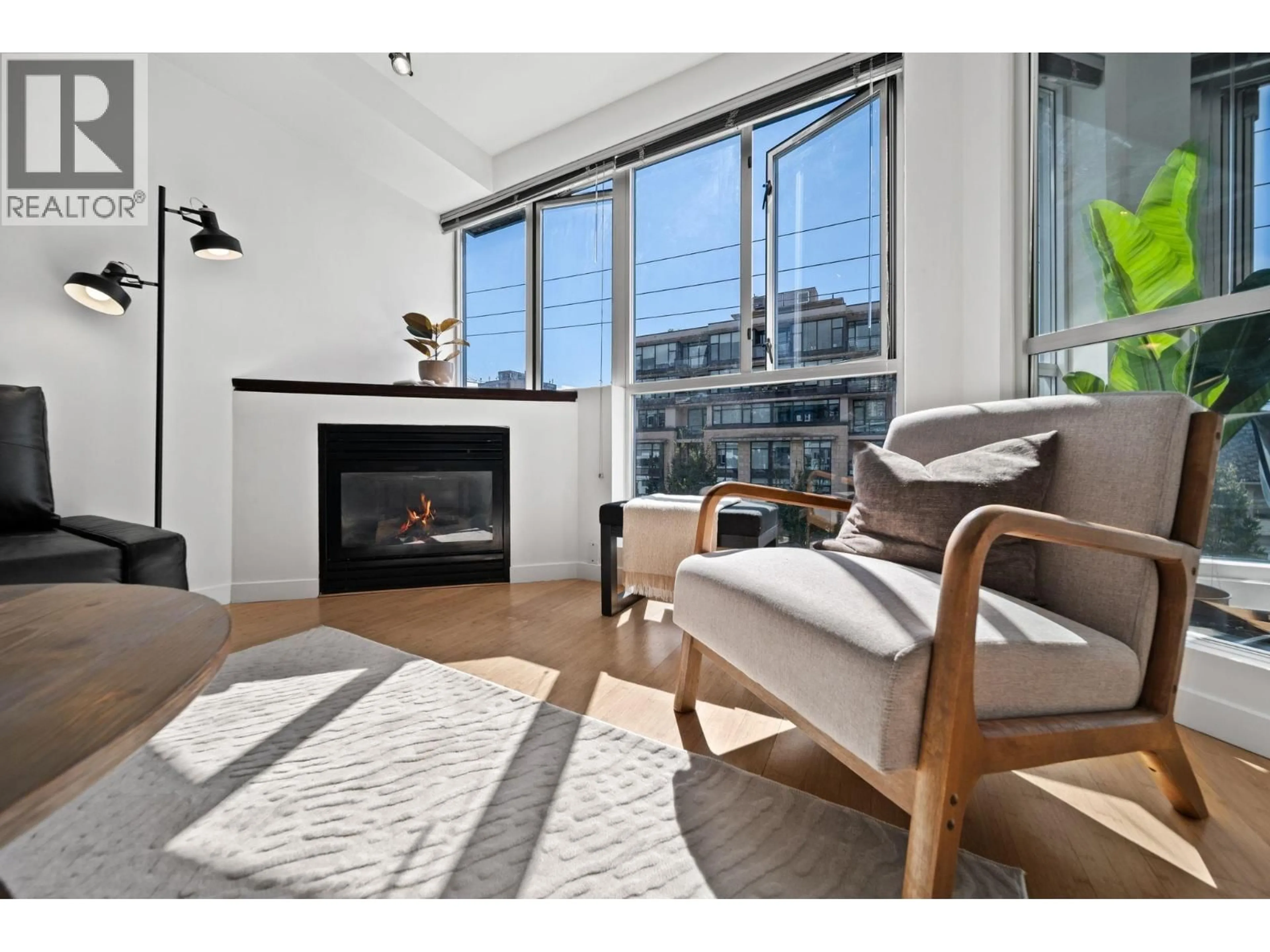 Living room with furniture, wood/laminate floor for 409 - 122 3RD STREET, North Vancouver British Columbia V7L1E6