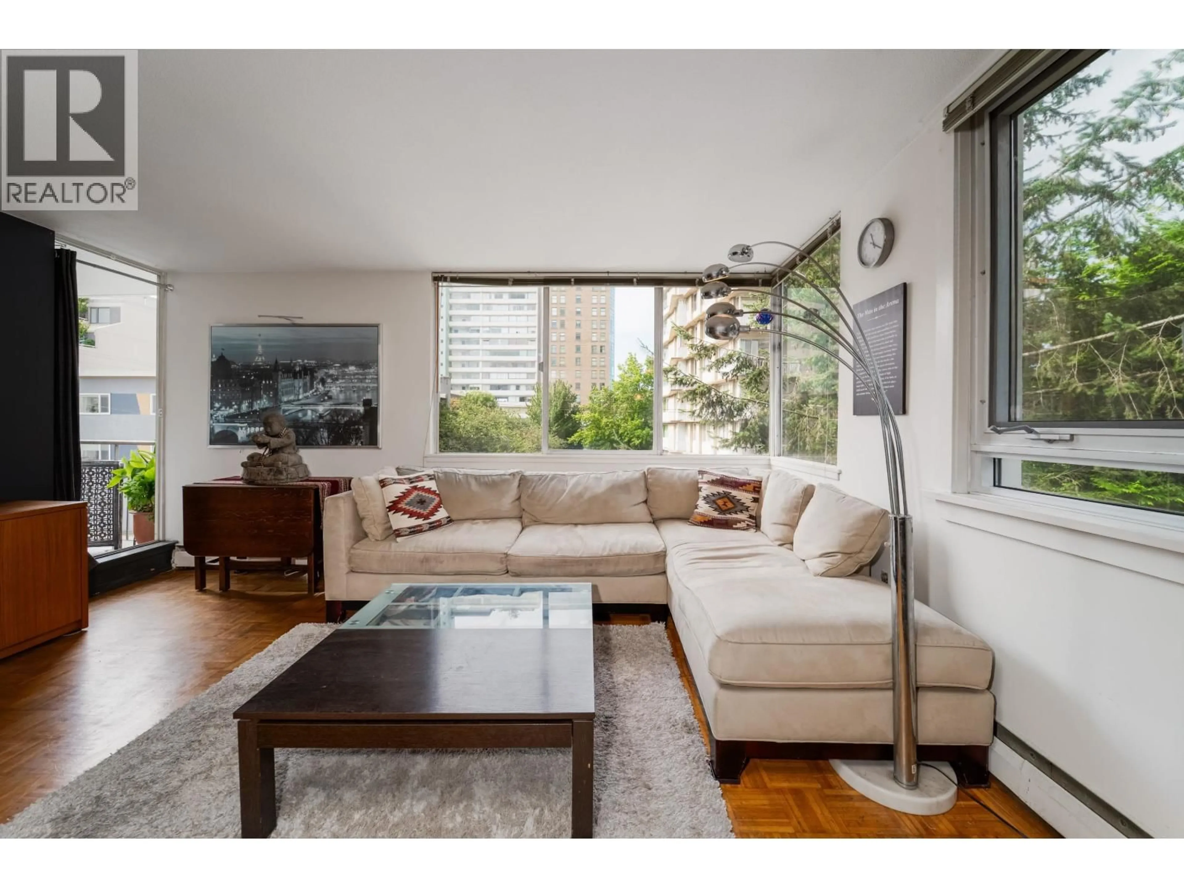 Living room with furniture, wood/laminate floor for 203 - 1850 COMOX STREET, Vancouver British Columbia V6G1R3
