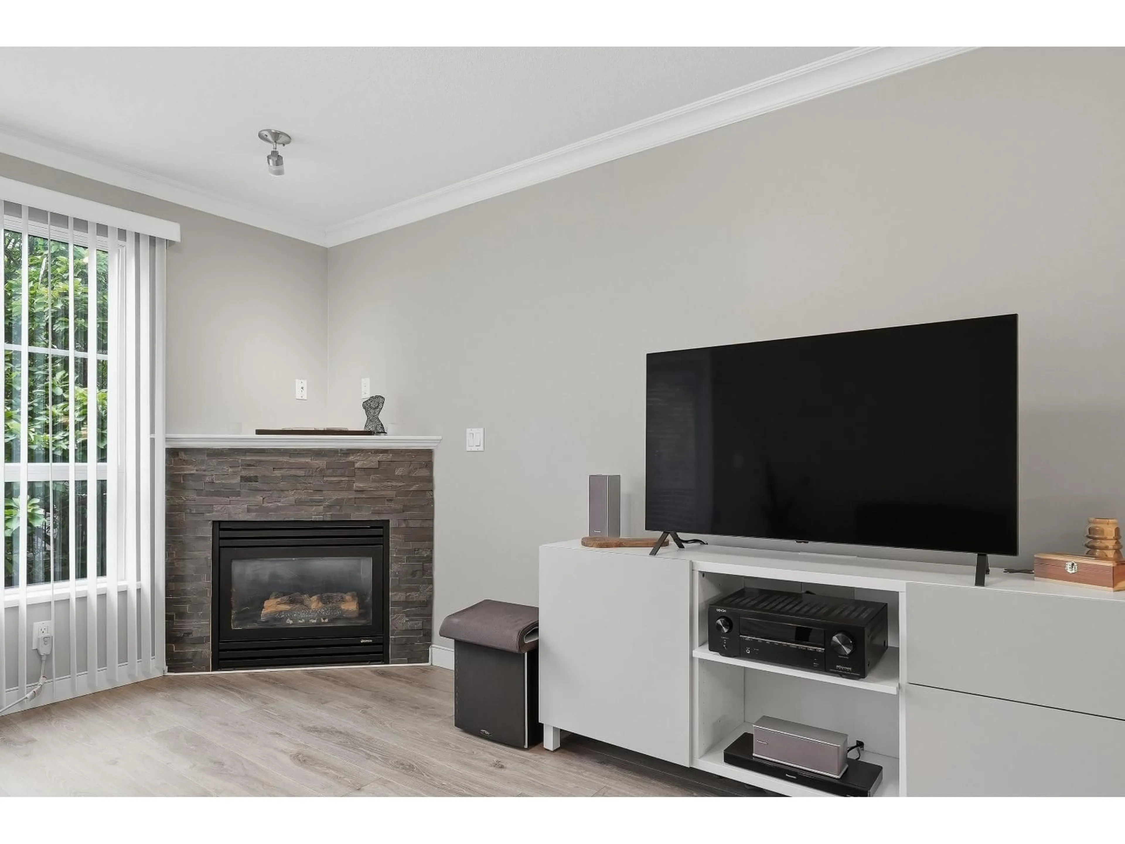 Living room with furniture, wood/laminate floor for 320 - 12083 92A AVENUE, Surrey British Columbia V3V8C8