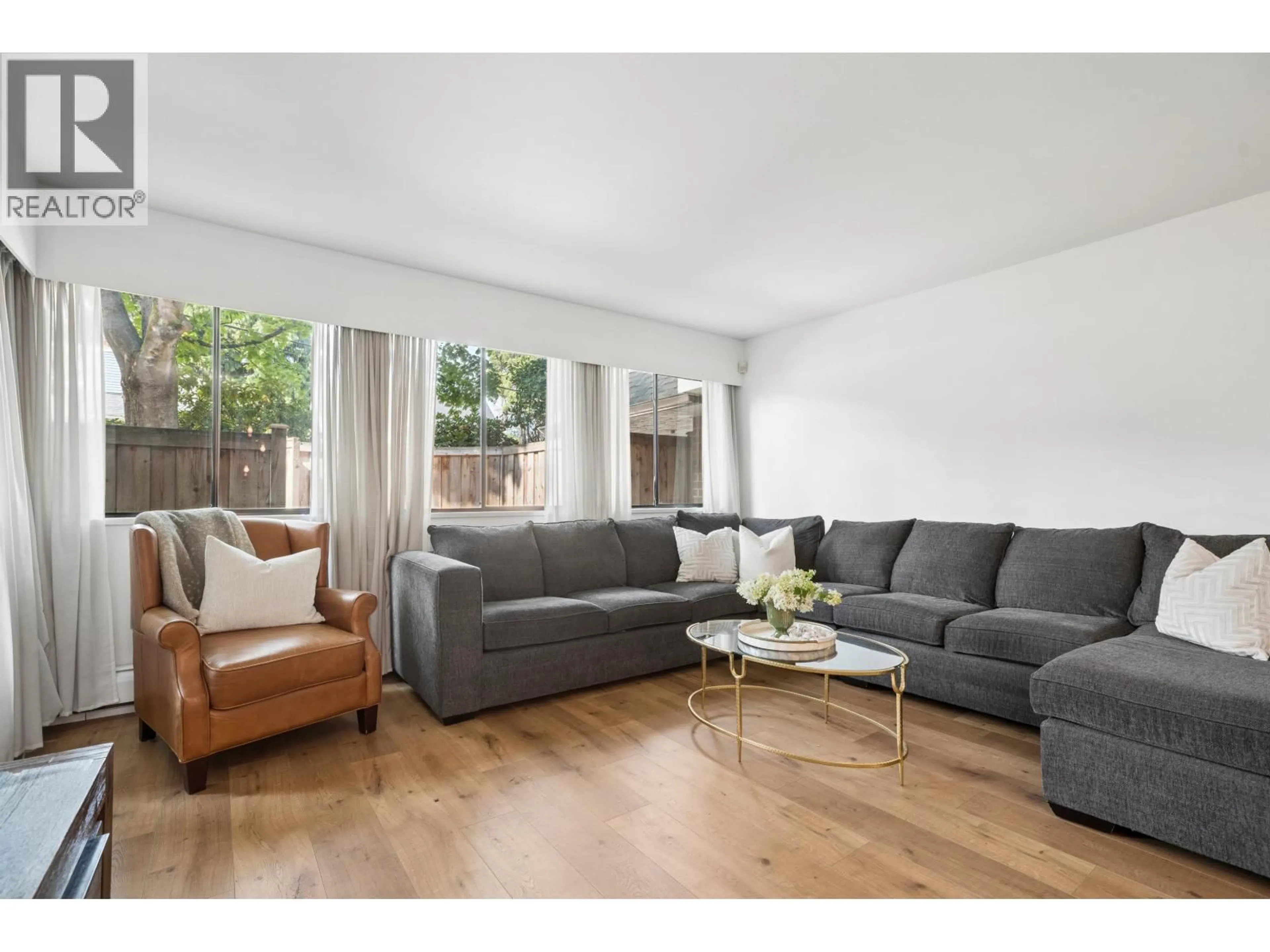 Living room with furniture, wood/laminate floor for 106 - 316 CEDAR STREET, New Westminster British Columbia V3L3P1