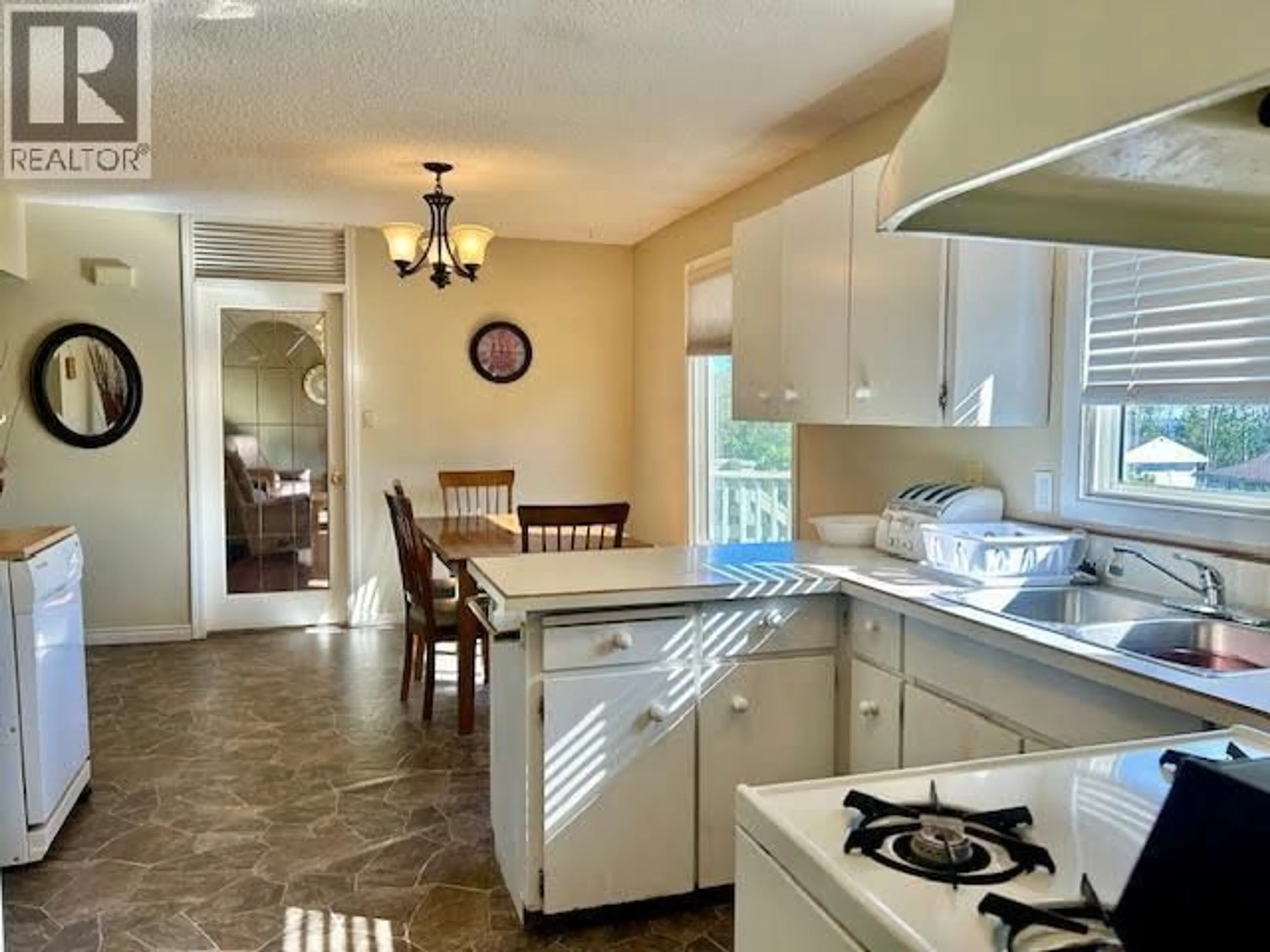 Open concept kitchen, ceramic/tile floor for 5408 54 AVENUE, Fort Nelson British Columbia V0C1R0