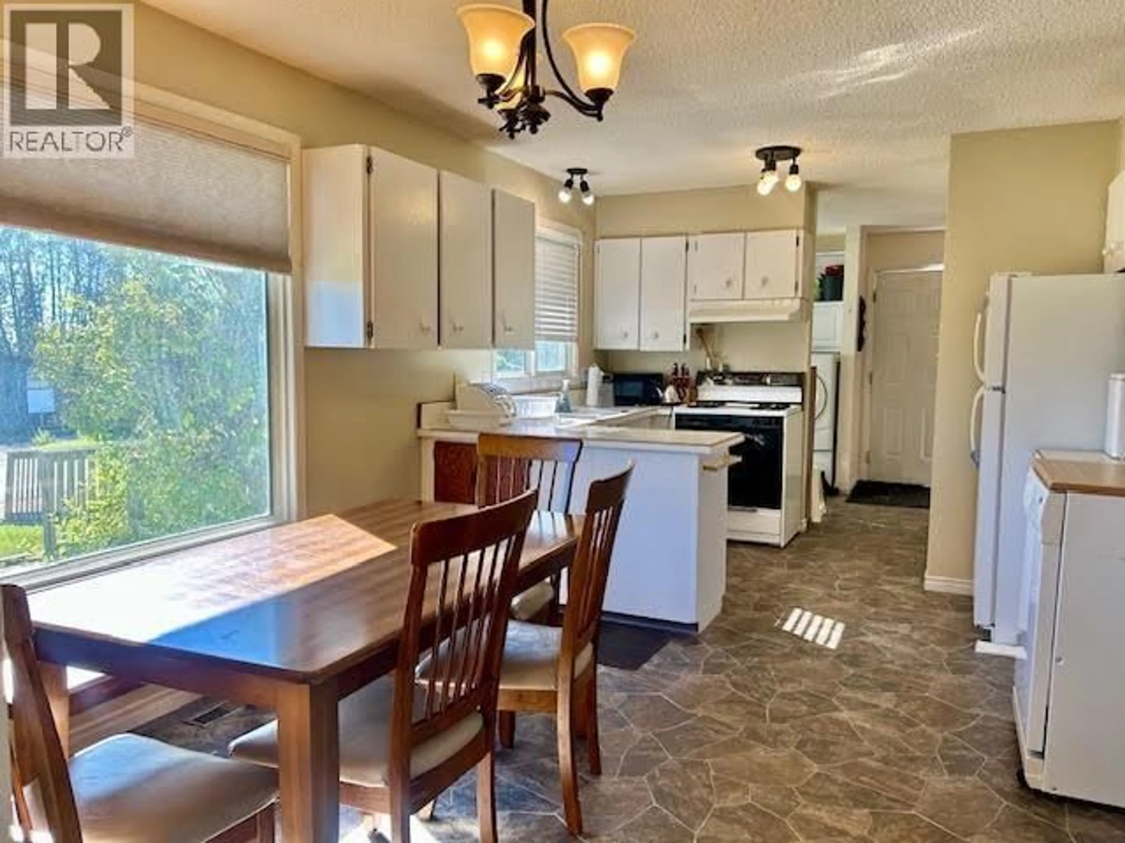 Open concept kitchen, ceramic/tile floor for 5408 54 AVENUE, Fort Nelson British Columbia V0C1R0