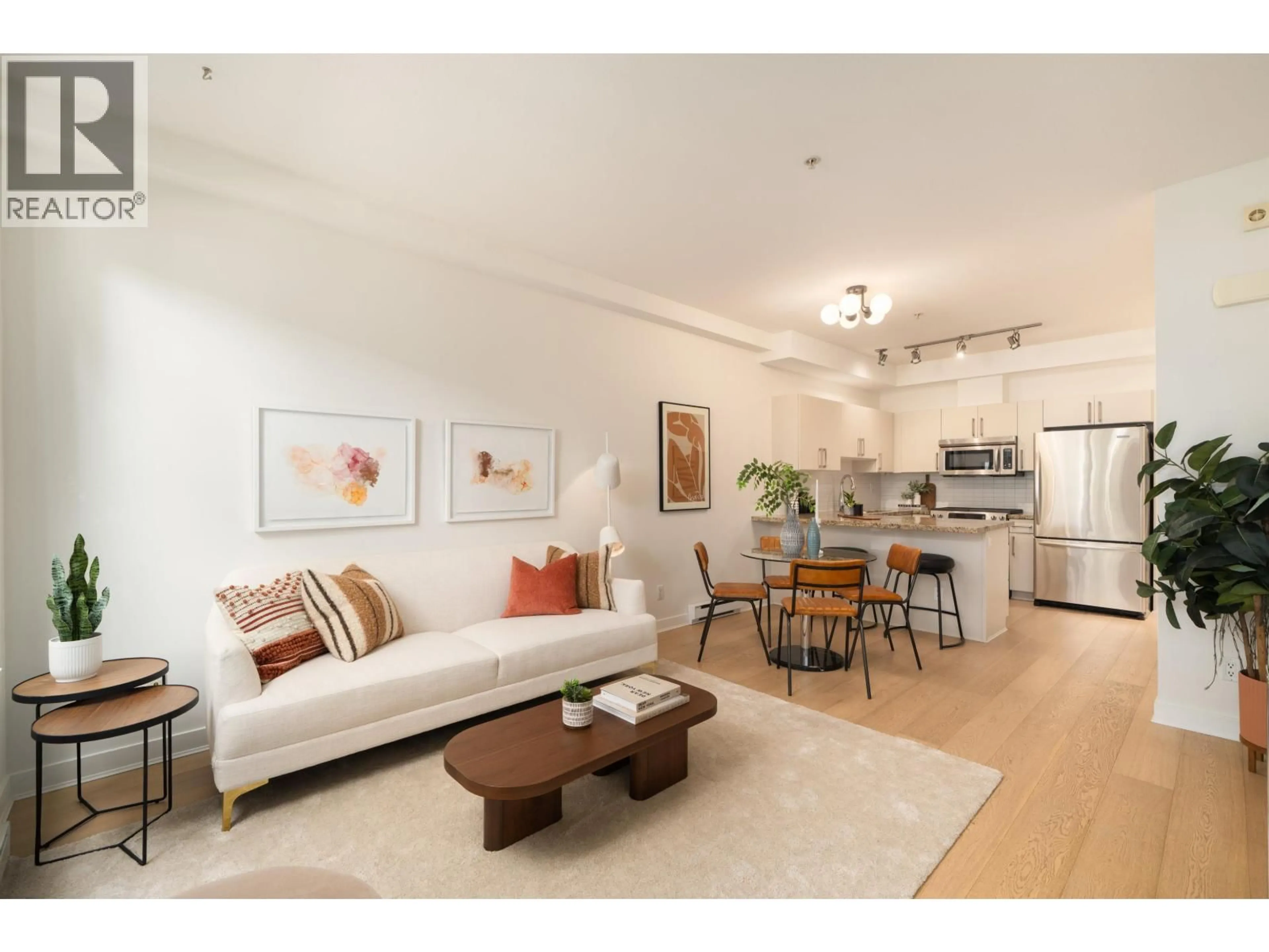 Living room with furniture, wood/laminate floor for 1835 STAINSBURY AVENUE, Vancouver British Columbia V5N2M6