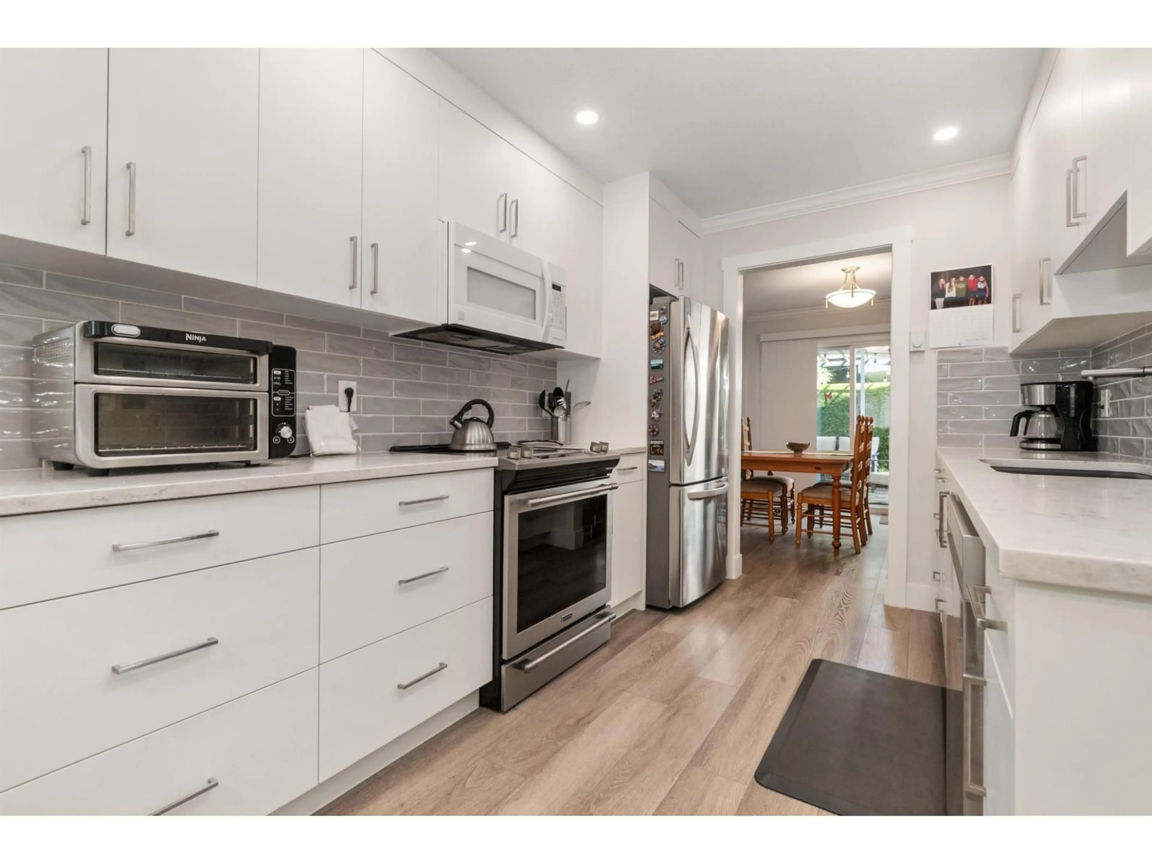 Open concept kitchen, wood/laminate floor for 14 - 46349 CESSNA DRIVE, Chilliwack British Columbia V2P1A7