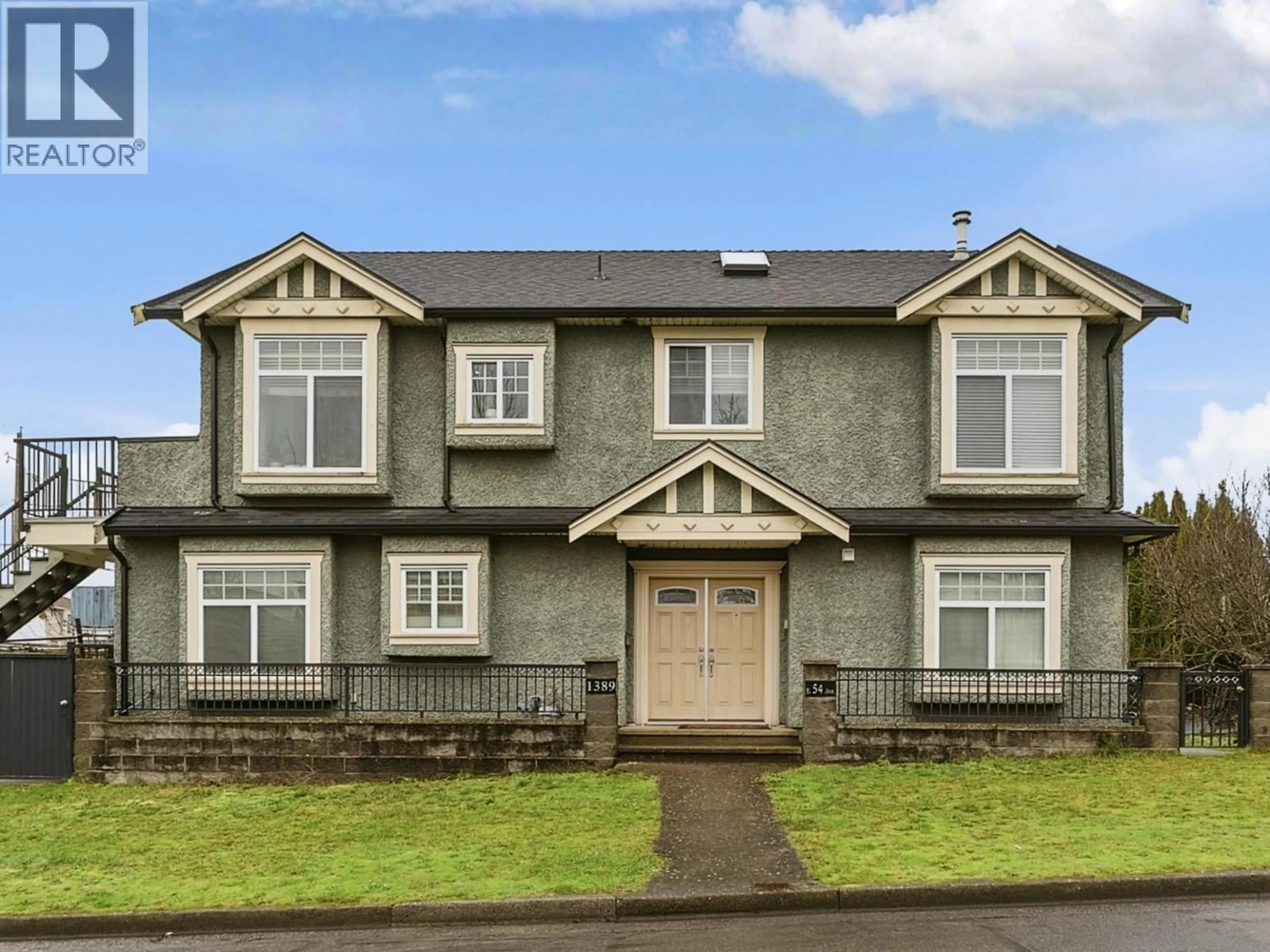 Home with vinyl exterior material, street for 1389 54TH AVENUE, Vancouver British Columbia V5X1M3