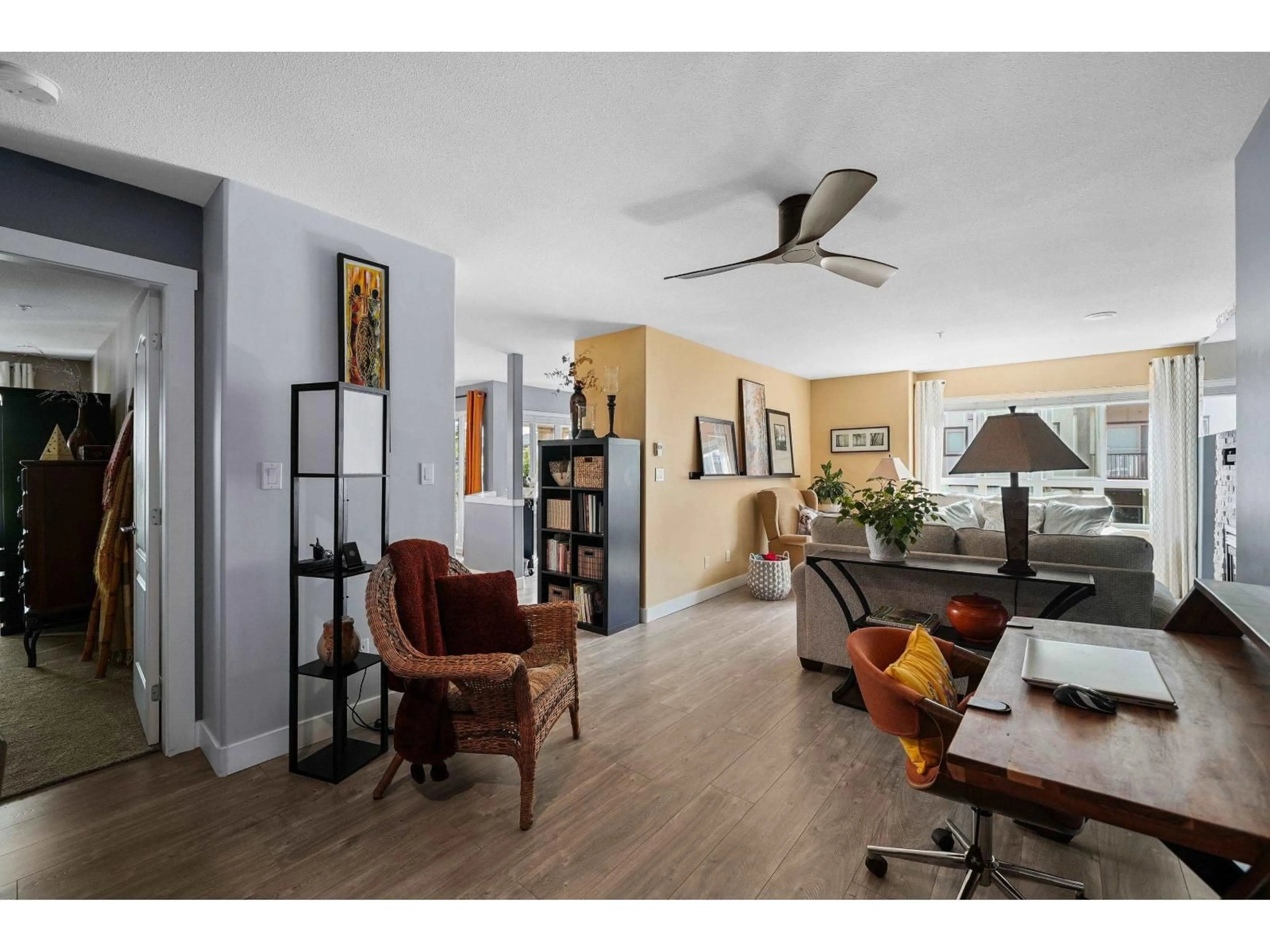 Living room with furniture, wood/laminate floor for 406 - 22022 49 AVENUE, Langley British Columbia V3A3R9