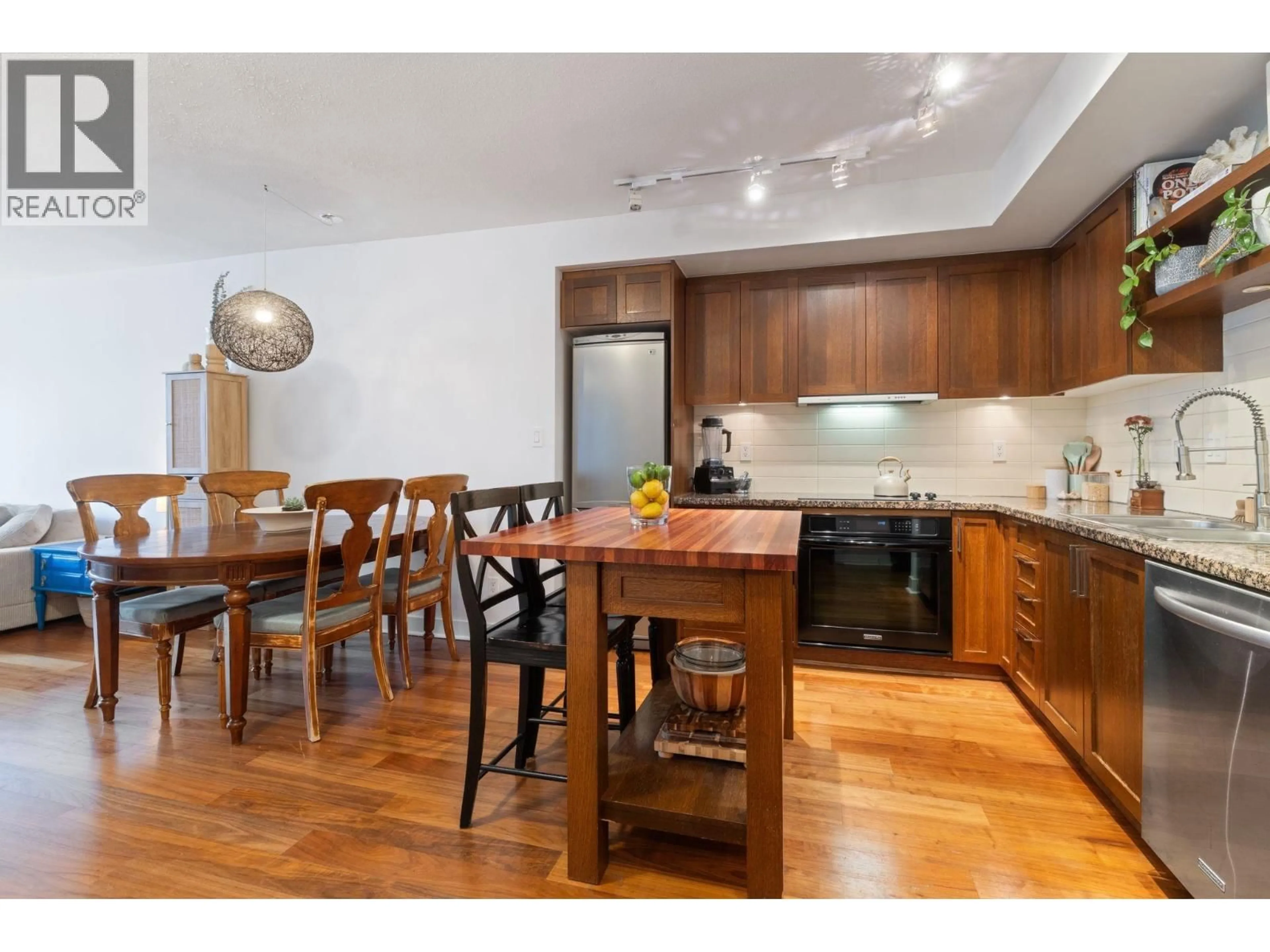 Open concept kitchen, wood/laminate floor for 608 - 2228 BROADWAY, Vancouver British Columbia V6K0B1