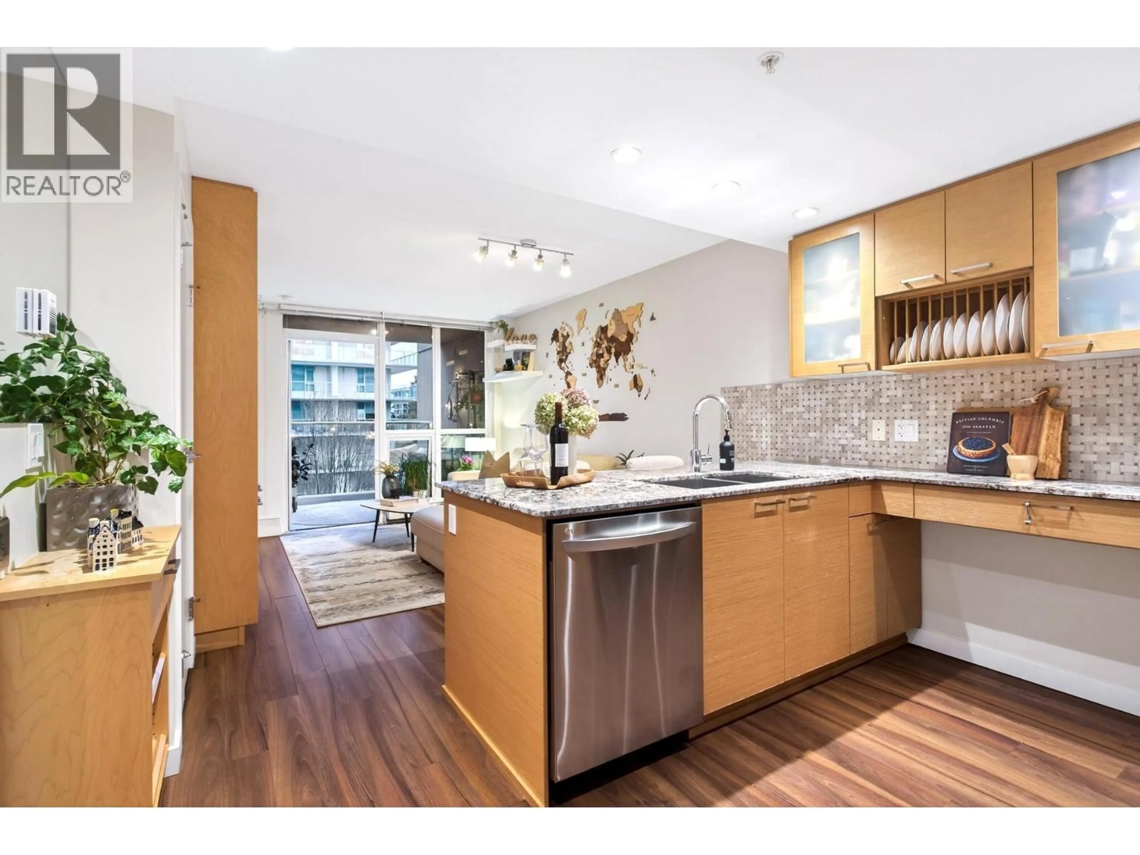 Open concept kitchen, wood/laminate floor for 413 - 135 17 STREET, North Vancouver British Columbia V7L0C4