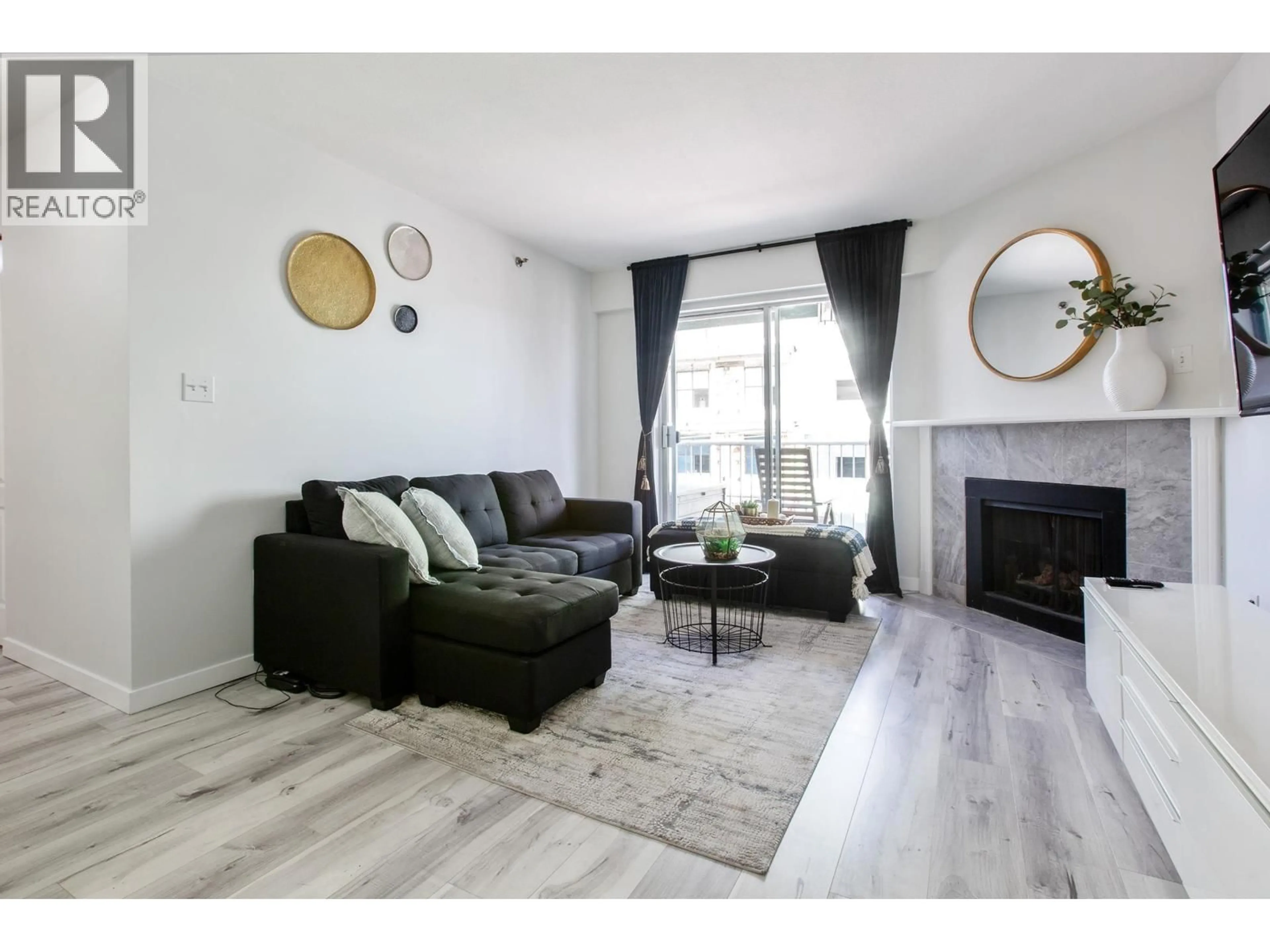 Living room with furniture, wood/laminate floor for 440 - 22661 LOUGHEED HIGHWAY, Maple Ridge British Columbia V2X2V4