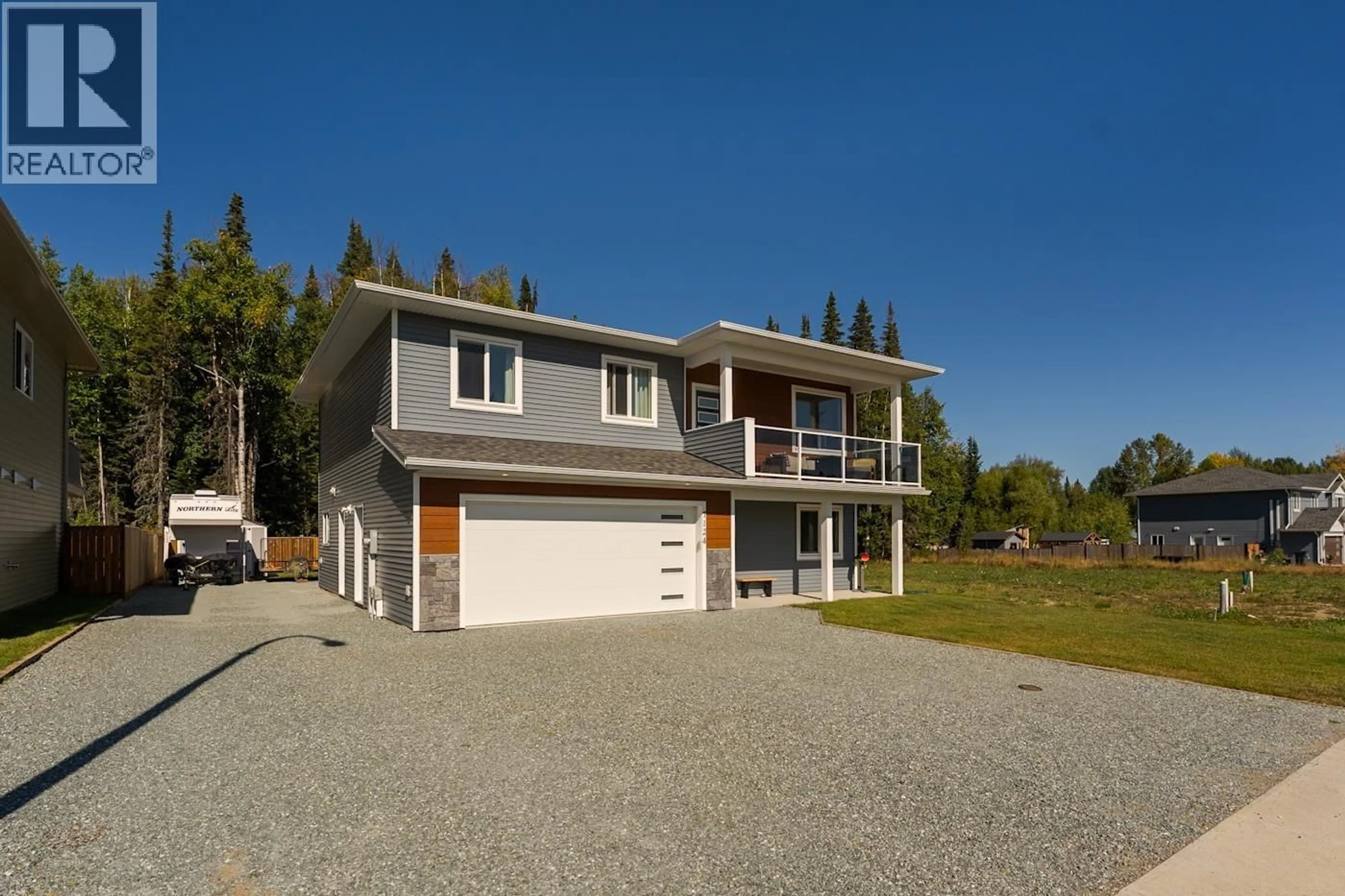 Home with vinyl exterior material, street for 7124 HILLU ROAD, Prince George British Columbia V2K0B4