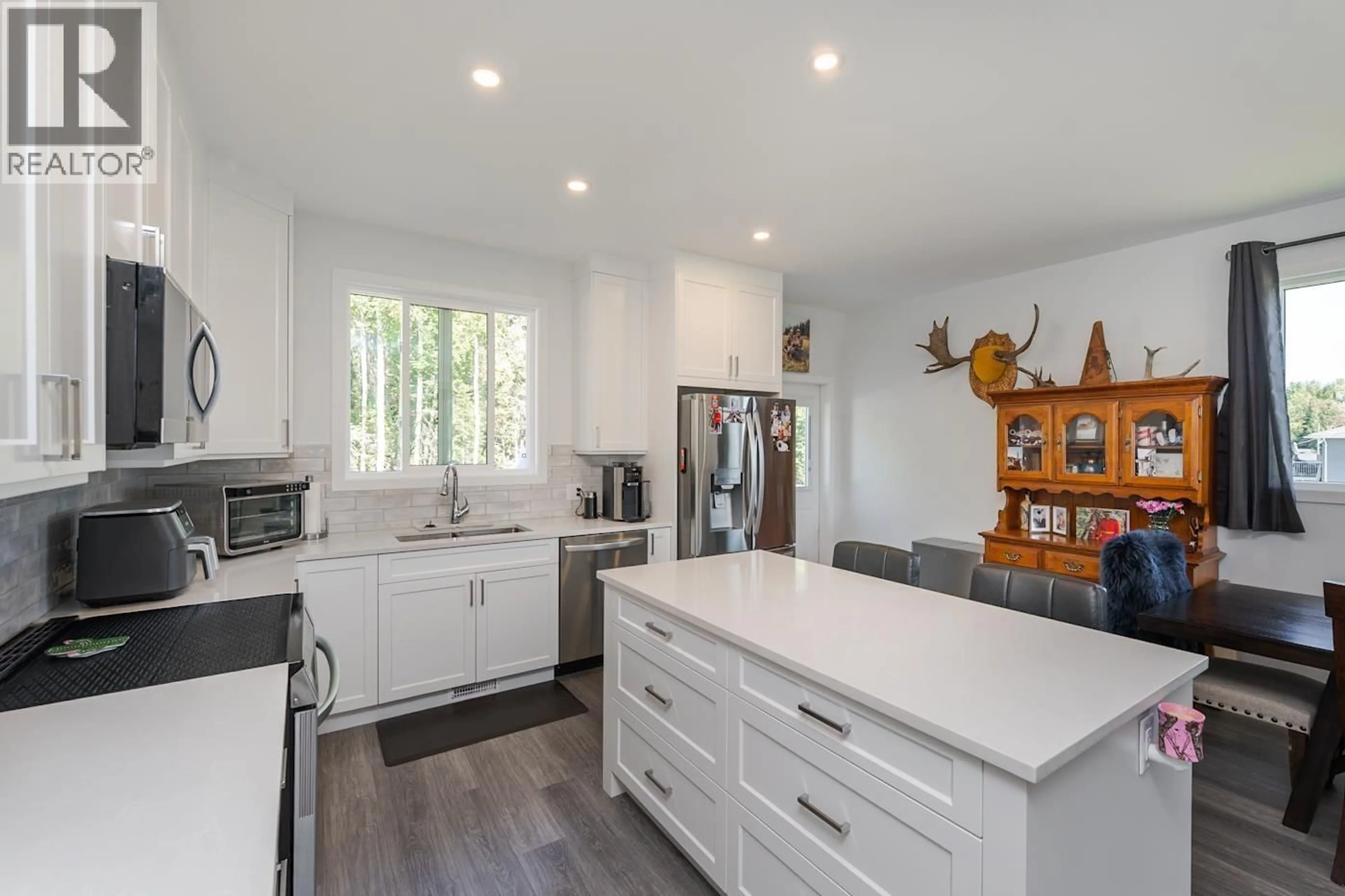 Open concept kitchen, wood/laminate floor for 7124 HILLU ROAD, Prince George British Columbia V2K0B4