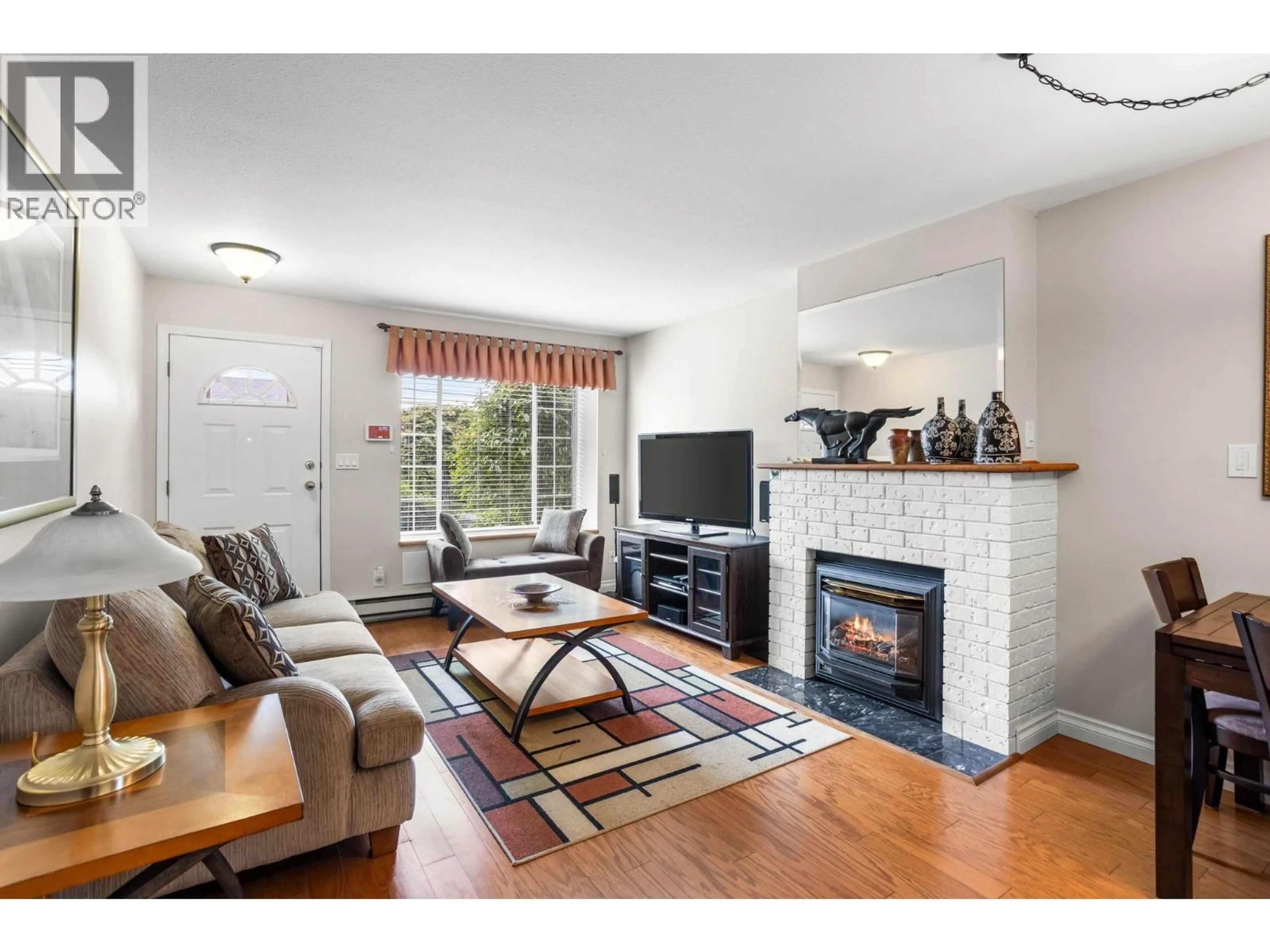 Living room with furniture, wood/laminate floor for 21 - 12276 189A STREET, Pitt Meadows British Columbia V3Y2G2