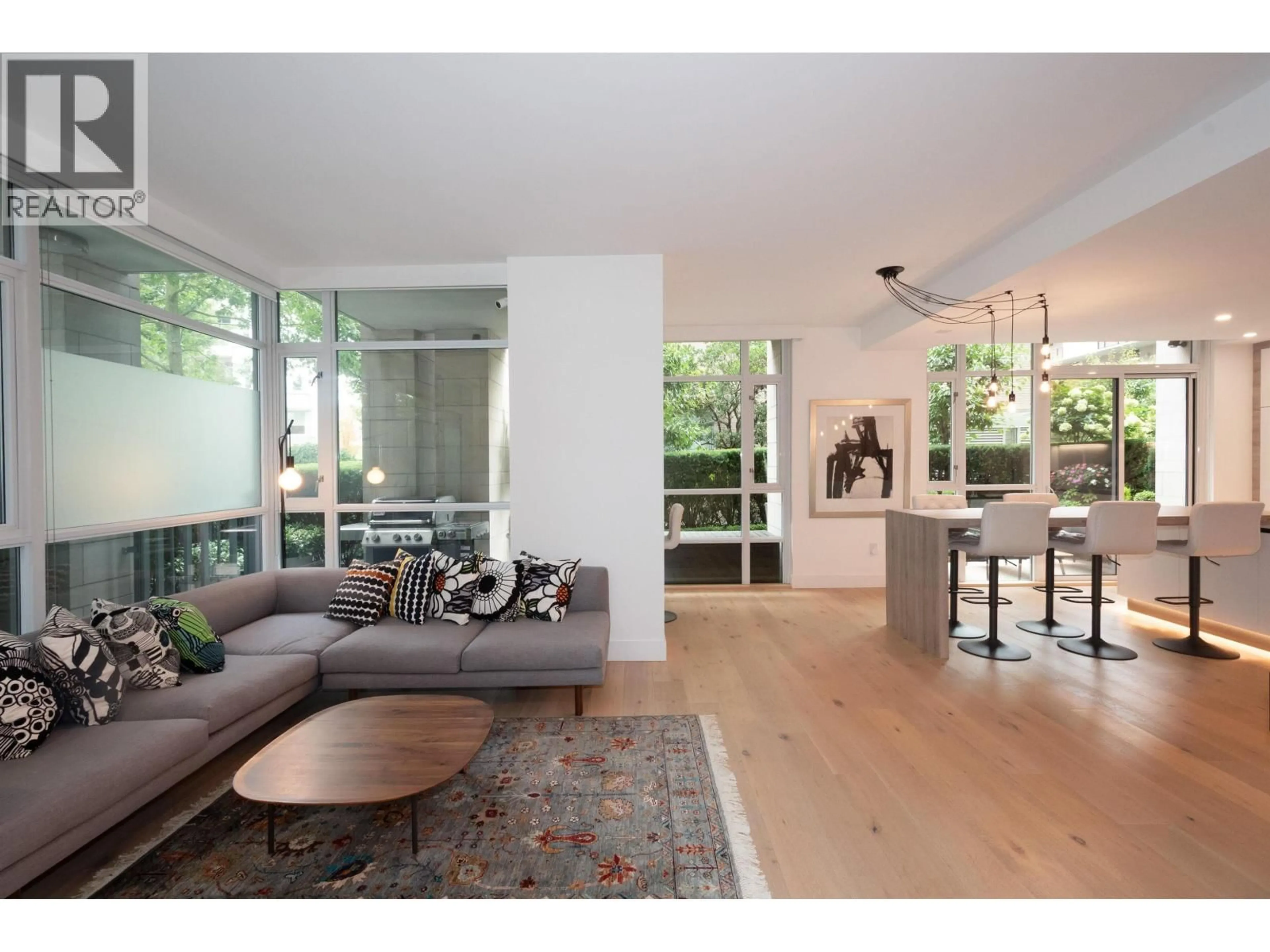 Living room with furniture, wood/laminate floor for 180 ATHLETES WAY, Vancouver British Columbia V5Y0B5