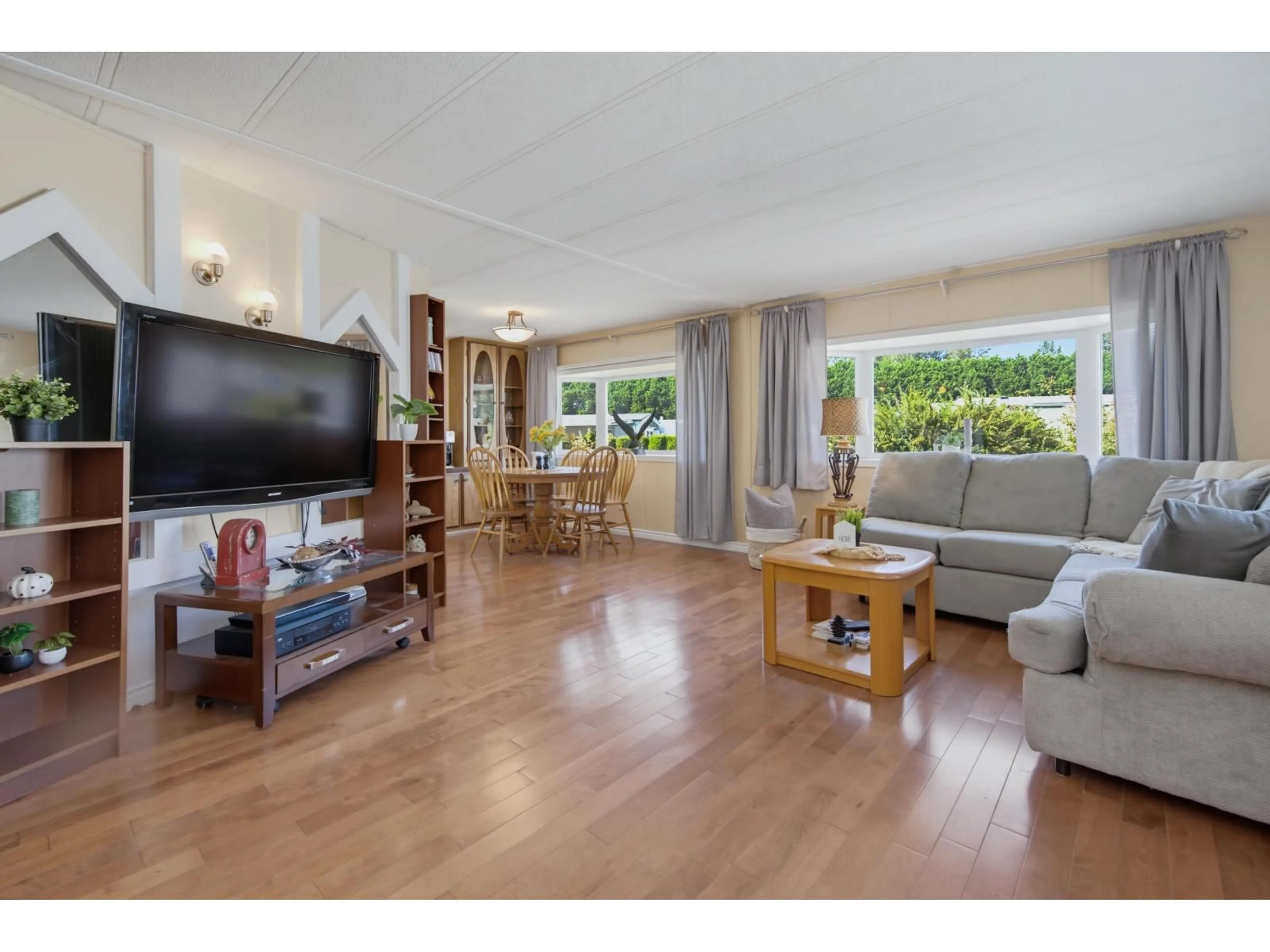 Living room with furniture, wood/laminate floor for 23 - 2270 196 STREET, Langley British Columbia V2Z1N6
