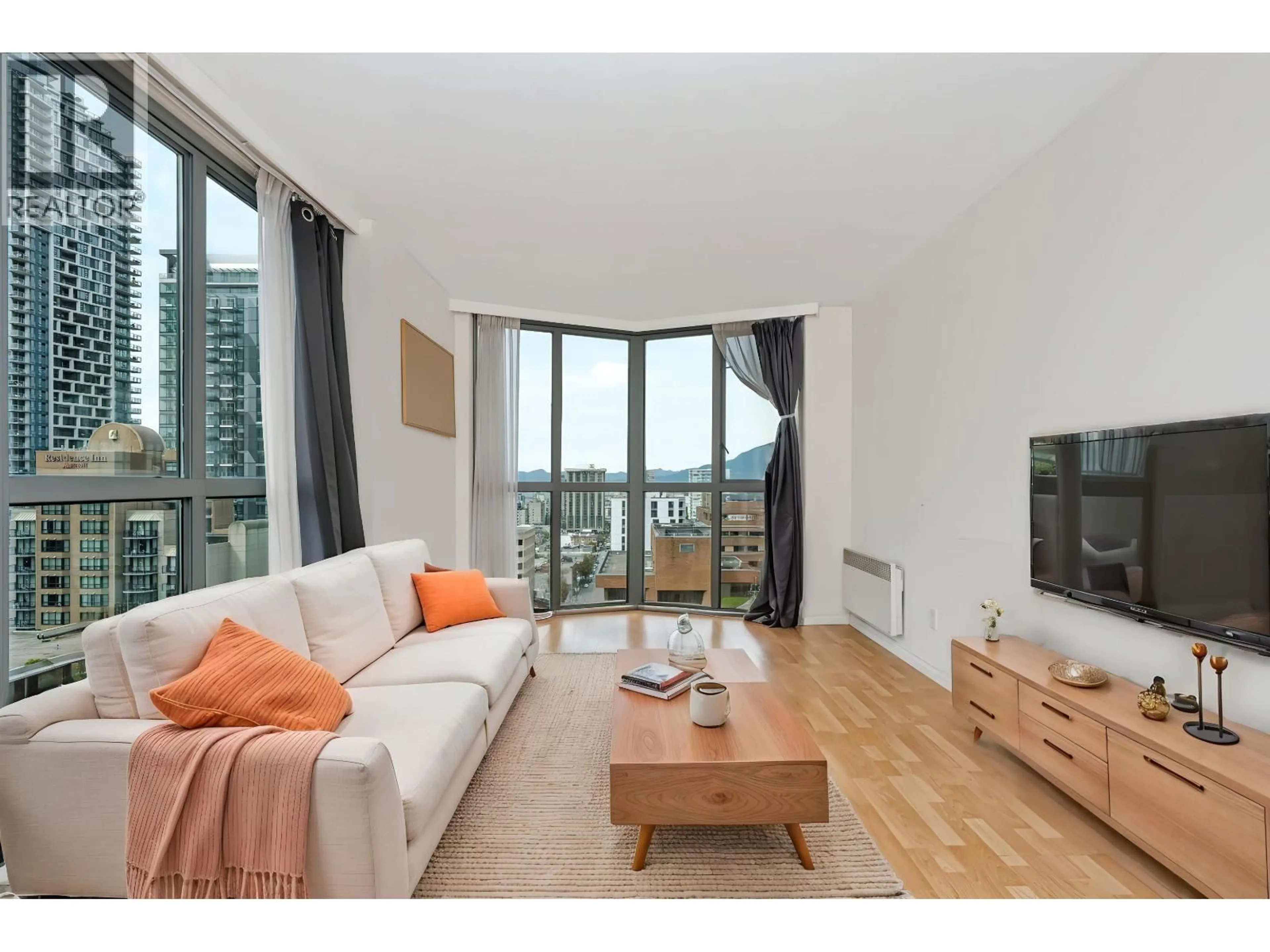 Living room with furniture, wood/laminate floor for 2401 - 1188 HOWE STREET, Vancouver British Columbia V6Z2S8