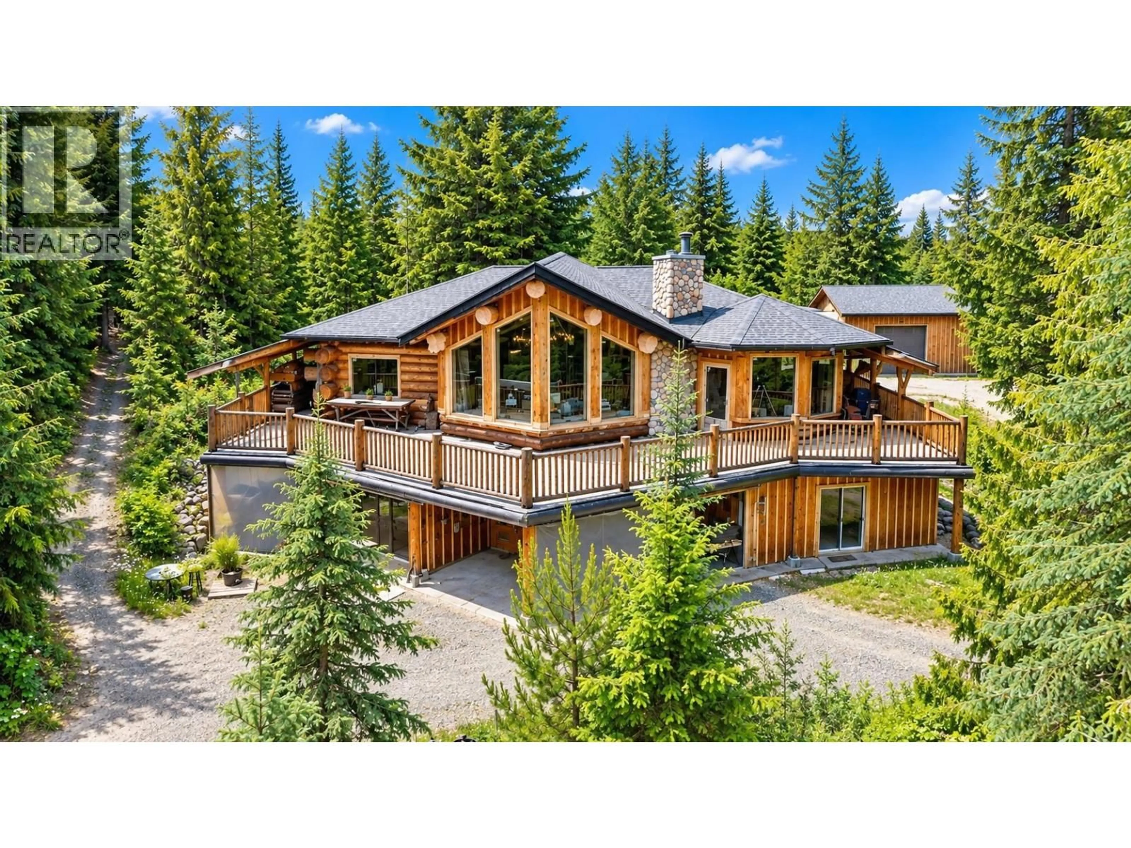 A pic from outside/outdoor area/front of a property/back of a property/a pic from drone, mountain view for 3561 CANIM HENDRIX ROAD, 100 Mile House British Columbia V0K1L0