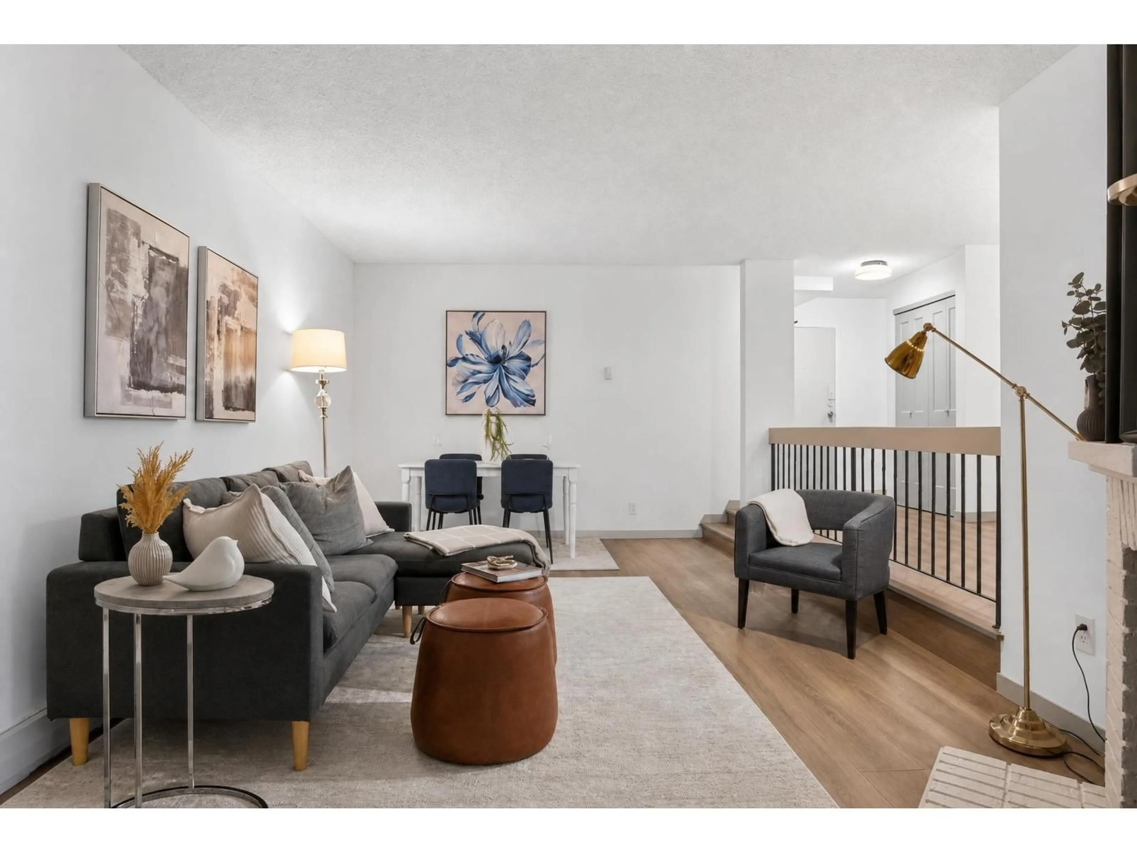 Living room with furniture, wood/laminate floor for 2114 - 13819 100 AVENUE, Surrey British Columbia V3T5L1