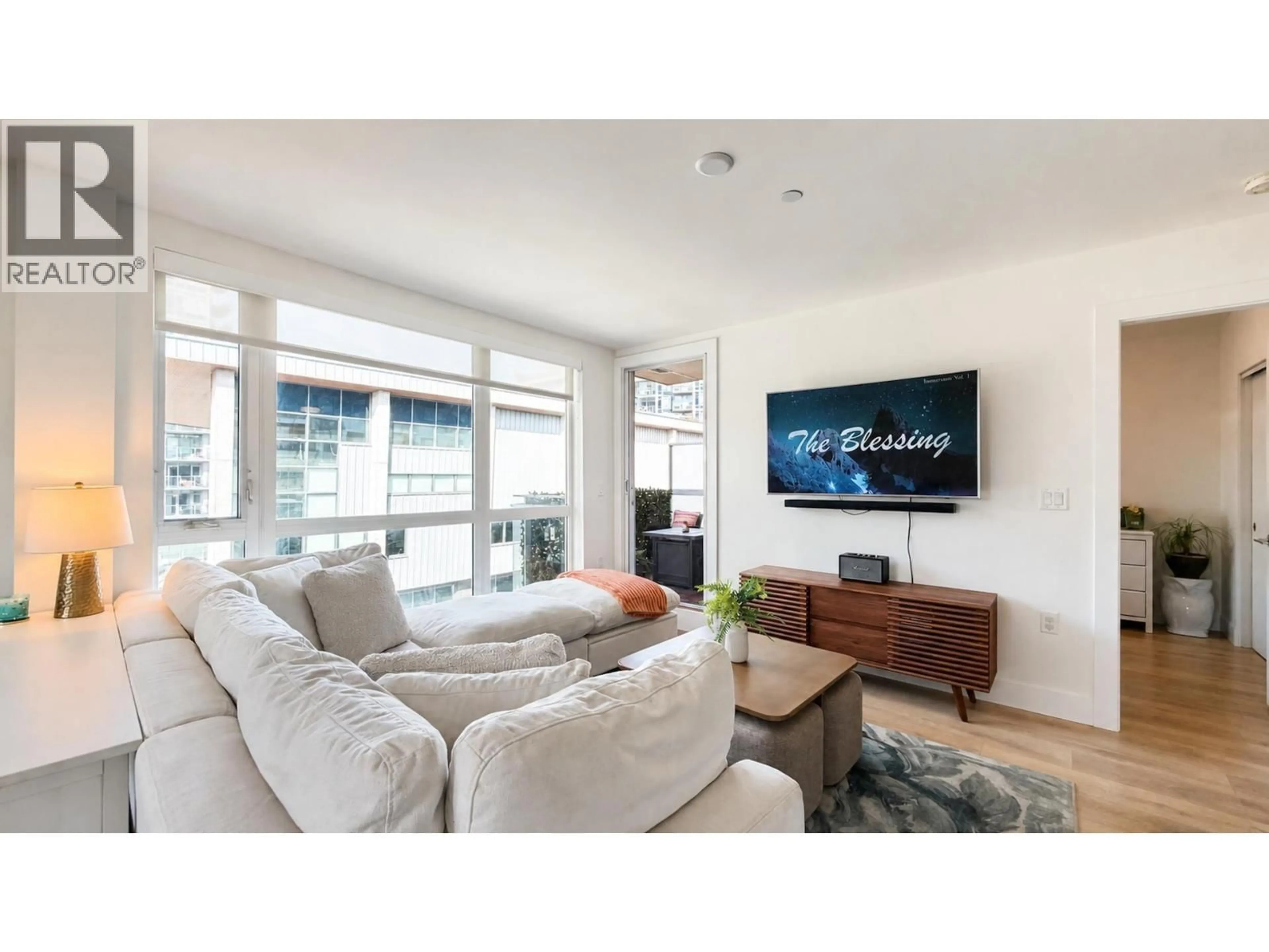 Living room with furniture, wood/laminate floor for 608 - 8580 RIVER DISTRICT CROSSING, Vancouver British Columbia V5S0B9