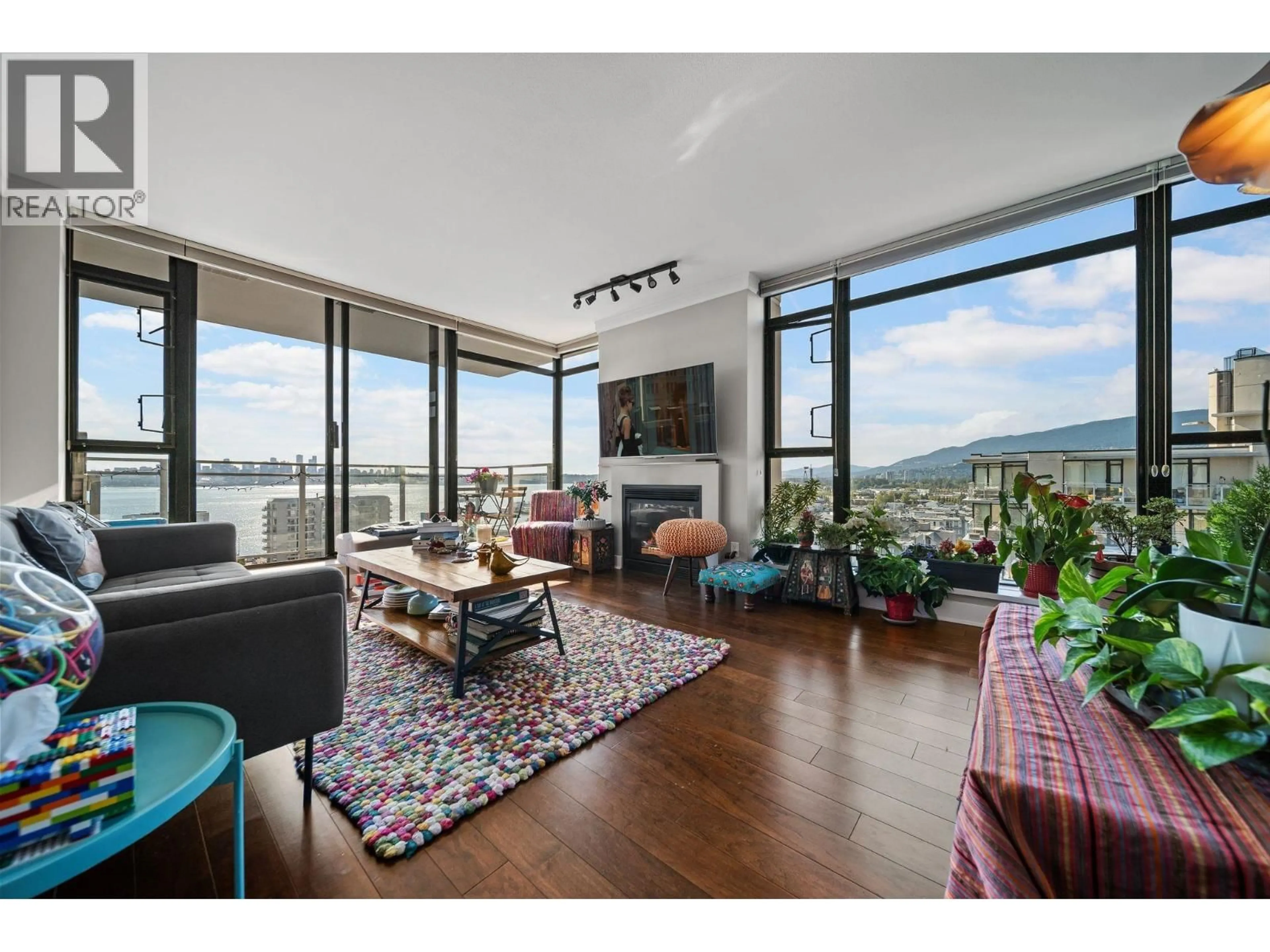 Living room with furniture, wood/laminate floor for 1404 - 155 1ST STREET, North Vancouver British Columbia V7M3N8