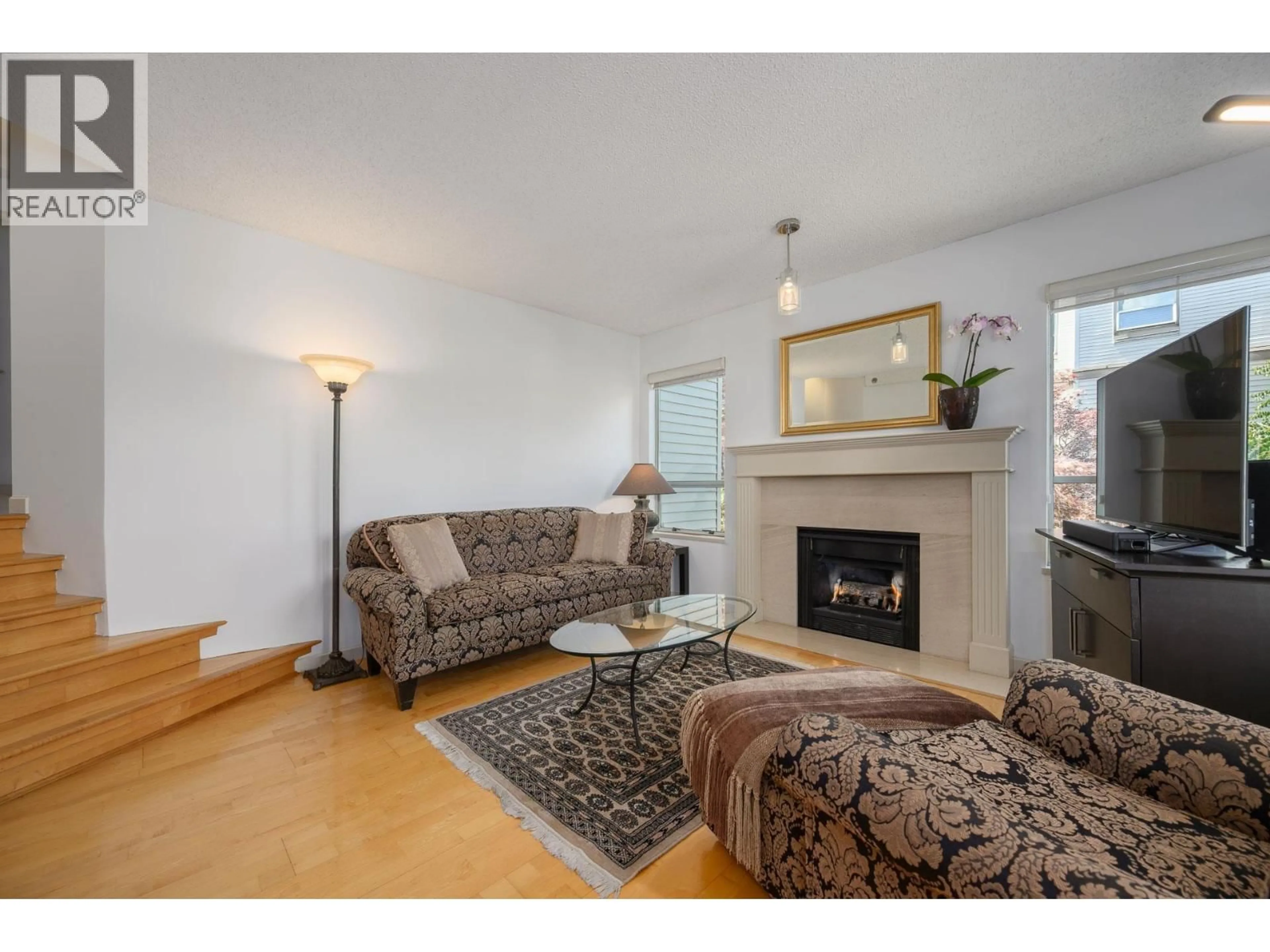Living room with furniture, wood/laminate floor for 212 - 910 8TH AVENUE, Vancouver British Columbia V5Z1E5