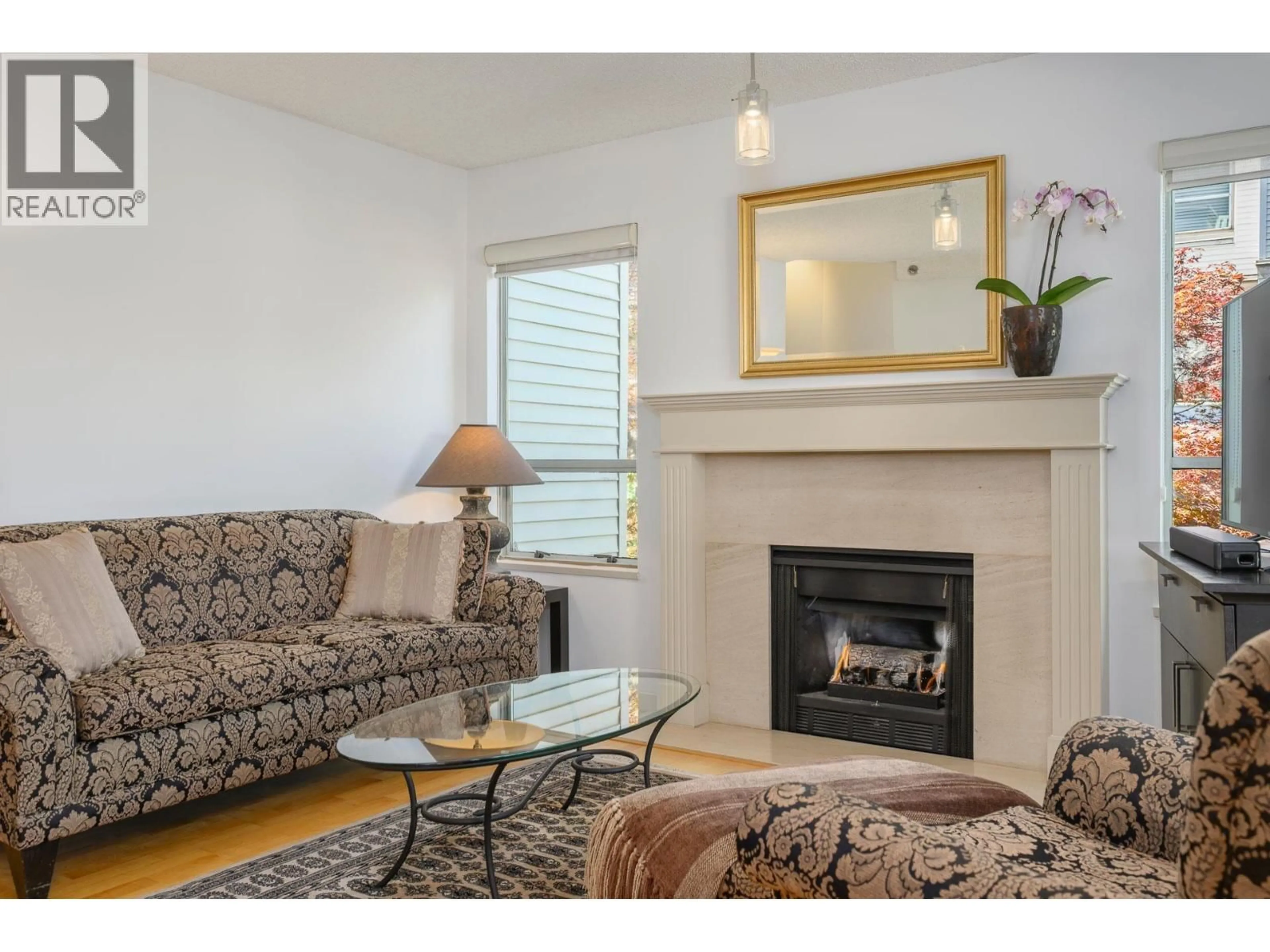 Living room with furniture, wood/laminate floor for 212 - 910 8TH AVENUE, Vancouver British Columbia V5Z1E5
