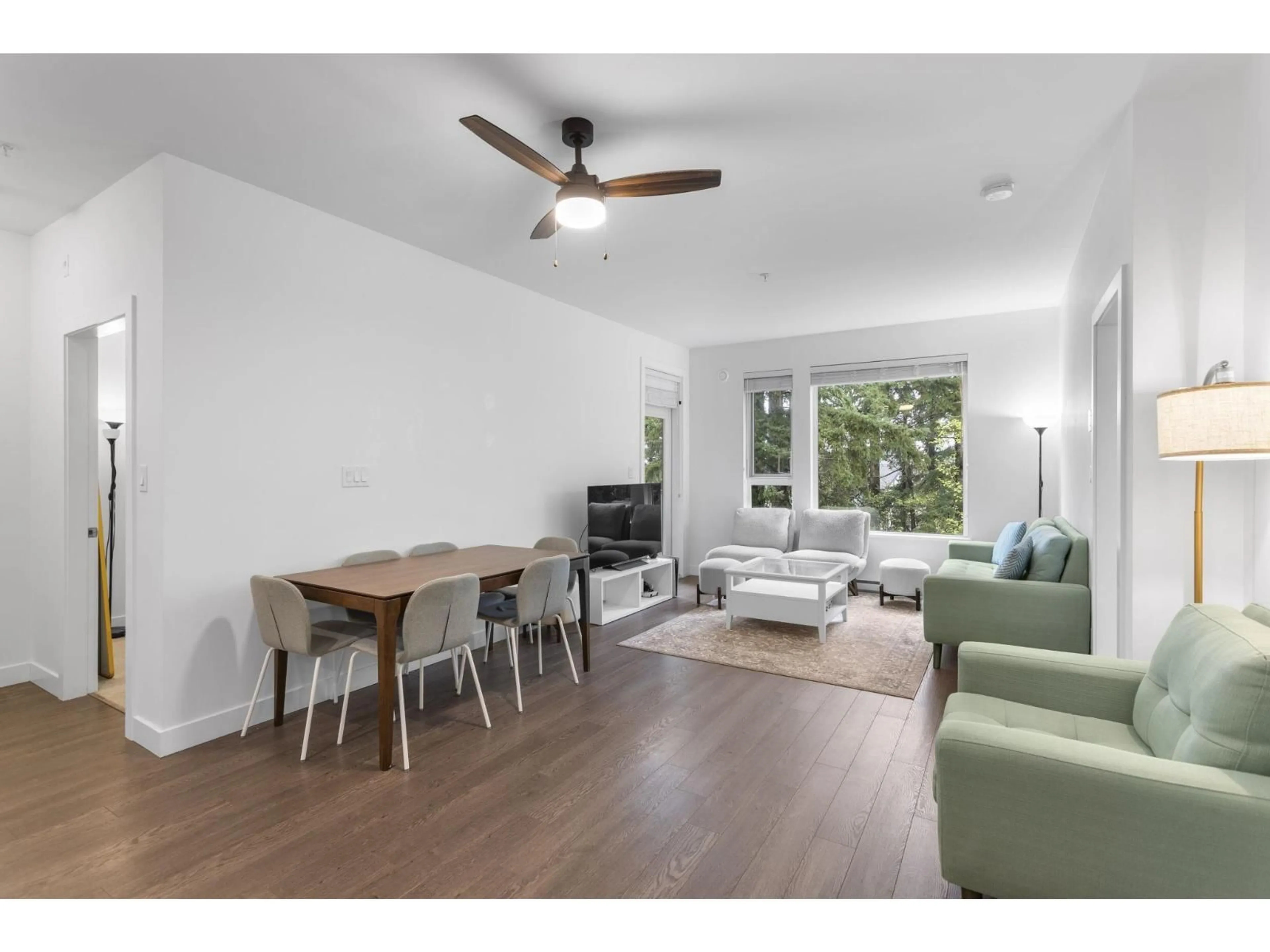 Living room with furniture, wood/laminate floor for 304 - 8360 DELSOM WAY, Delta British Columbia V4C0E6