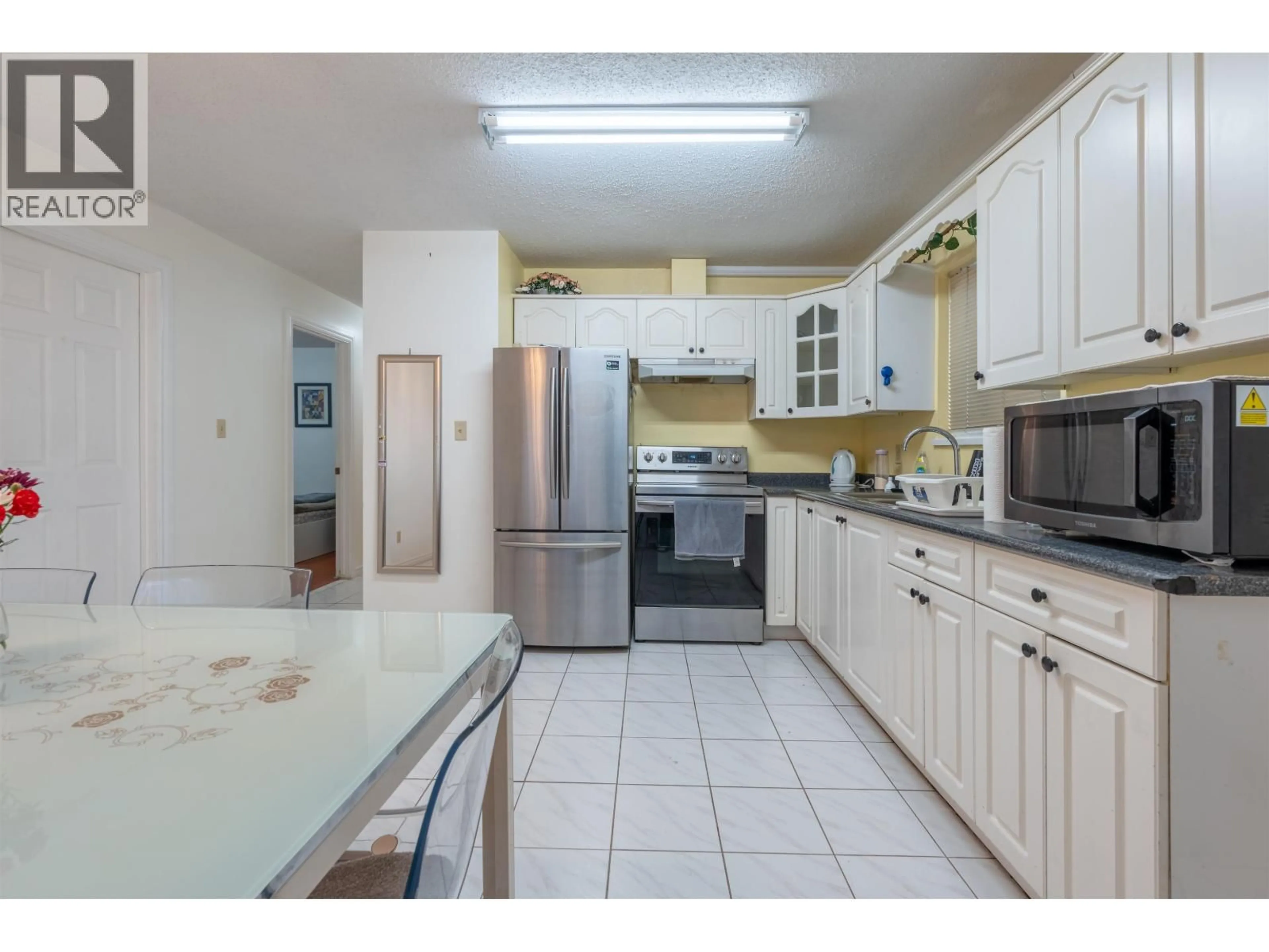 Standard kitchen, ceramic/tile floor for 3681 ADANAC STREET, Vancouver British Columbia V5K2P7