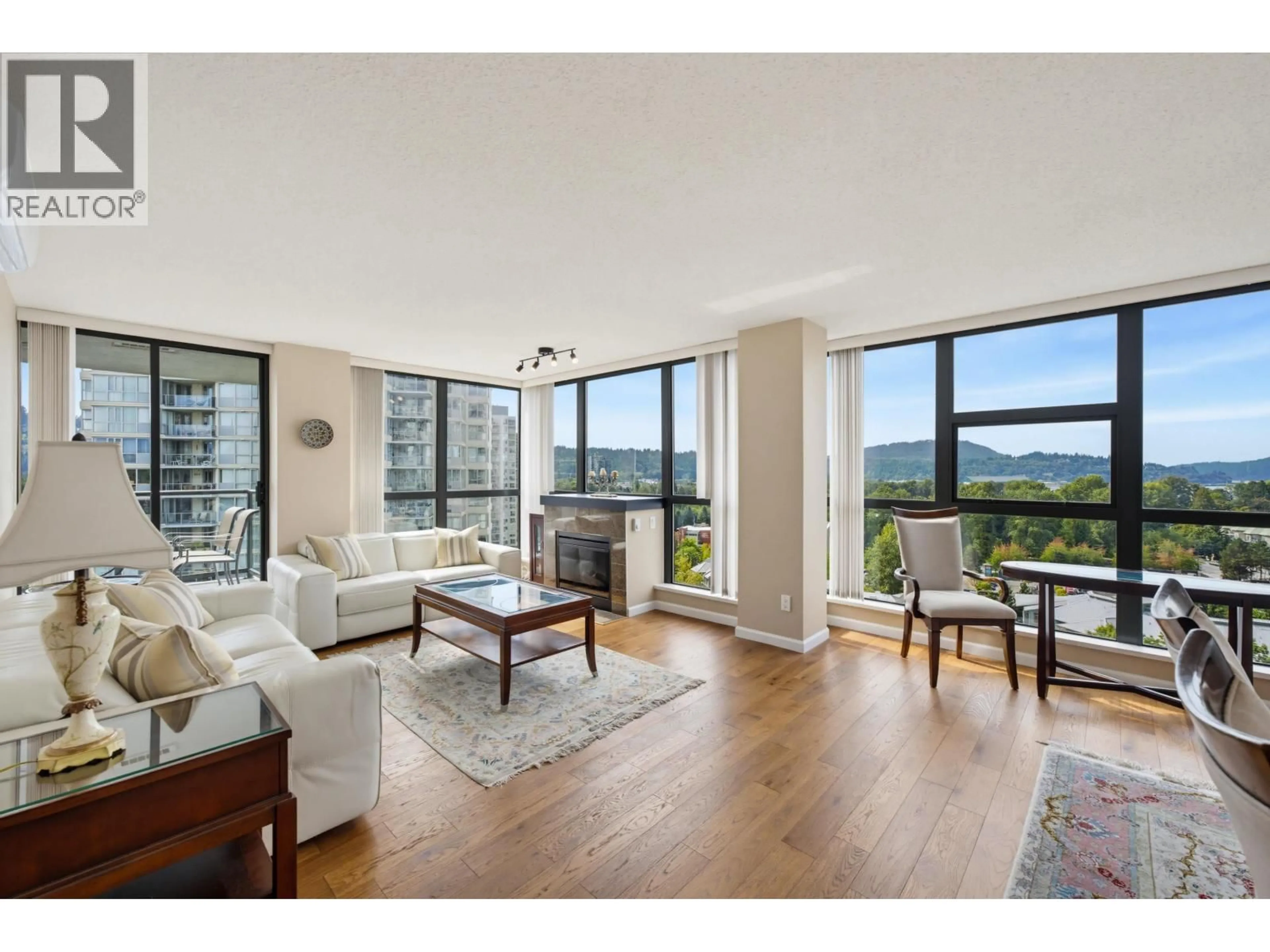 Living room with furniture, wood/laminate floor for 1105 - 288 UNGLESS WAY, Port Moody British Columbia V3H0C9