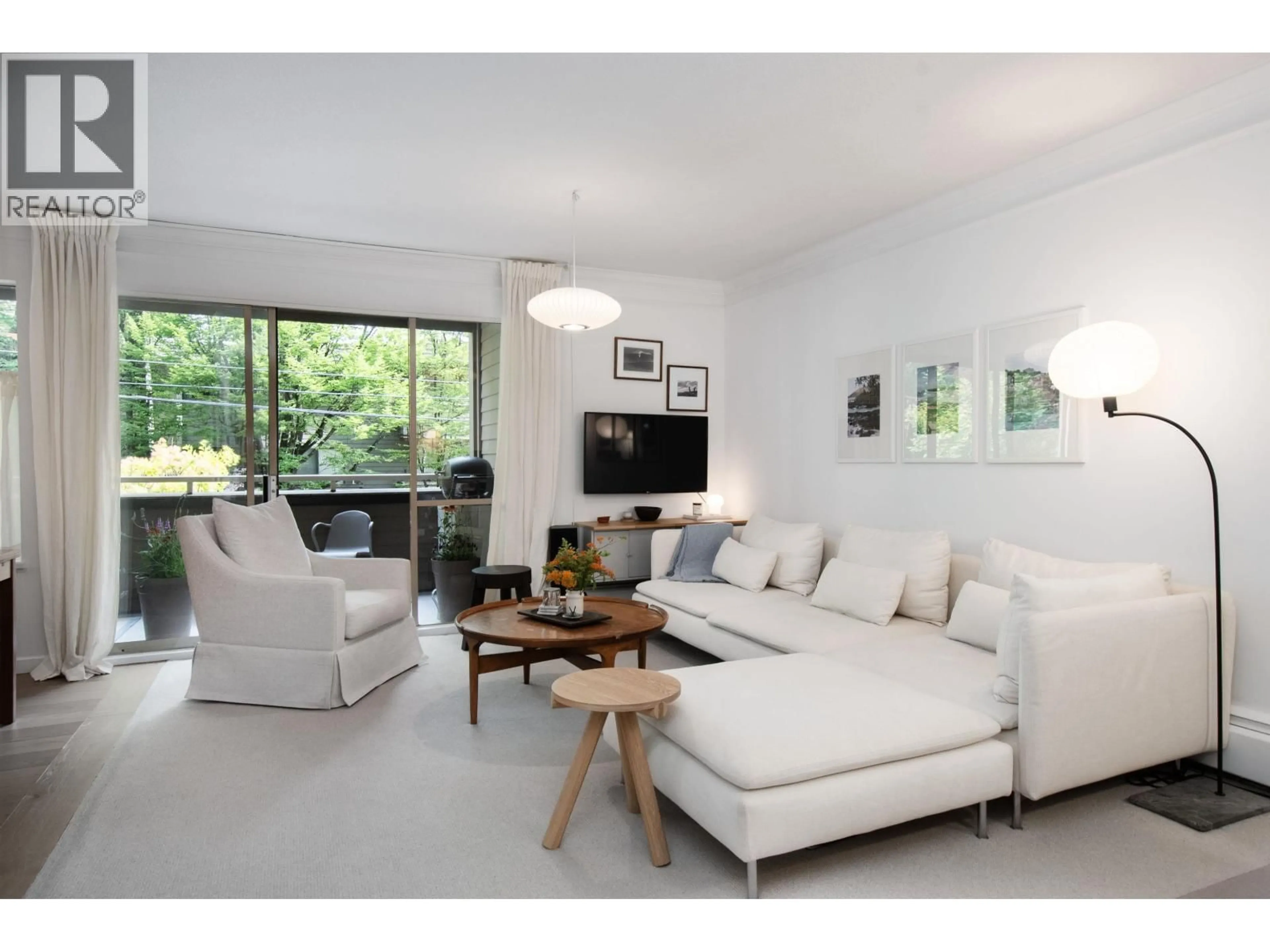 Living room with furniture, wood/laminate floor for 201 - 1777 13TH AVENUE, Vancouver British Columbia V6J2H2