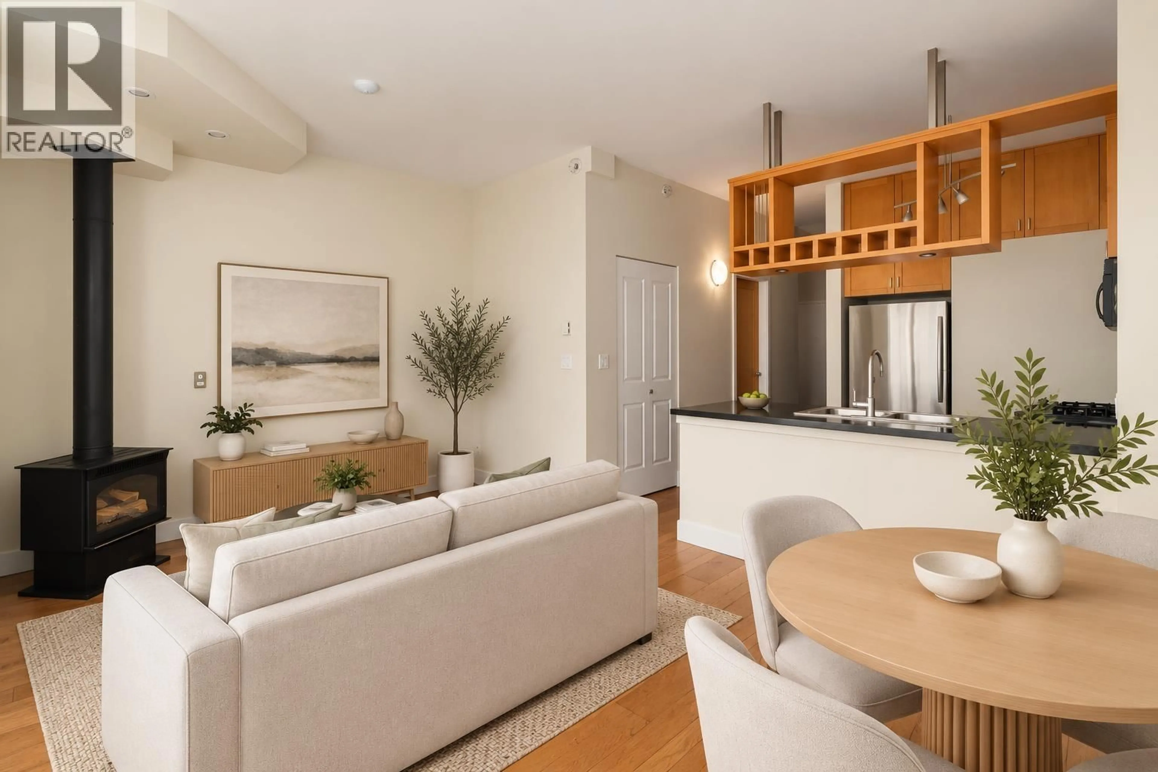Living room with furniture, wood/laminate floor for 322 - 8988 HUDSON STREET, Vancouver British Columbia V6P6Z1