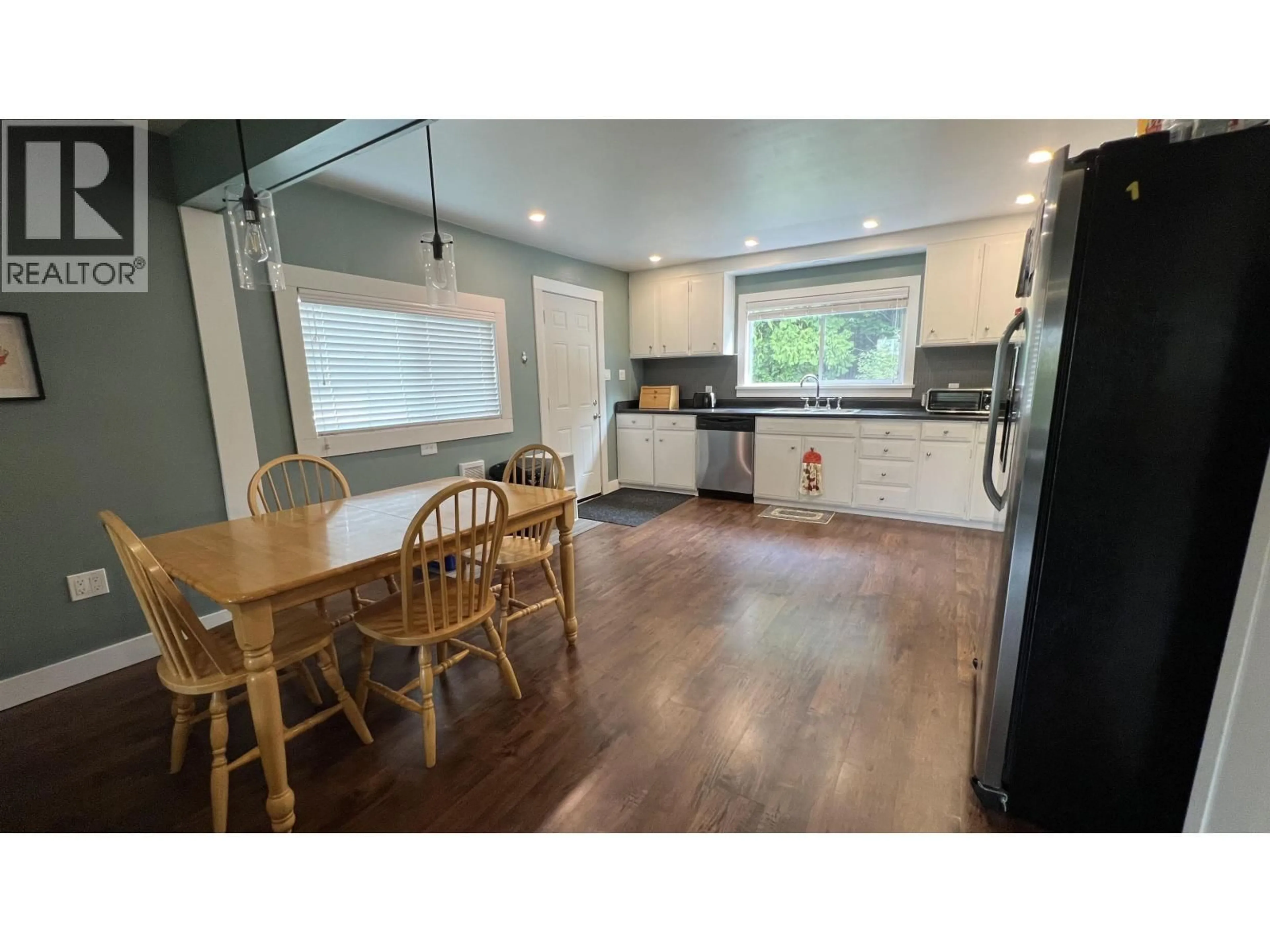 Open concept kitchen, wood/laminate floor for 710 8TH AVENUE, Prince Rupert British Columbia V8J2M9