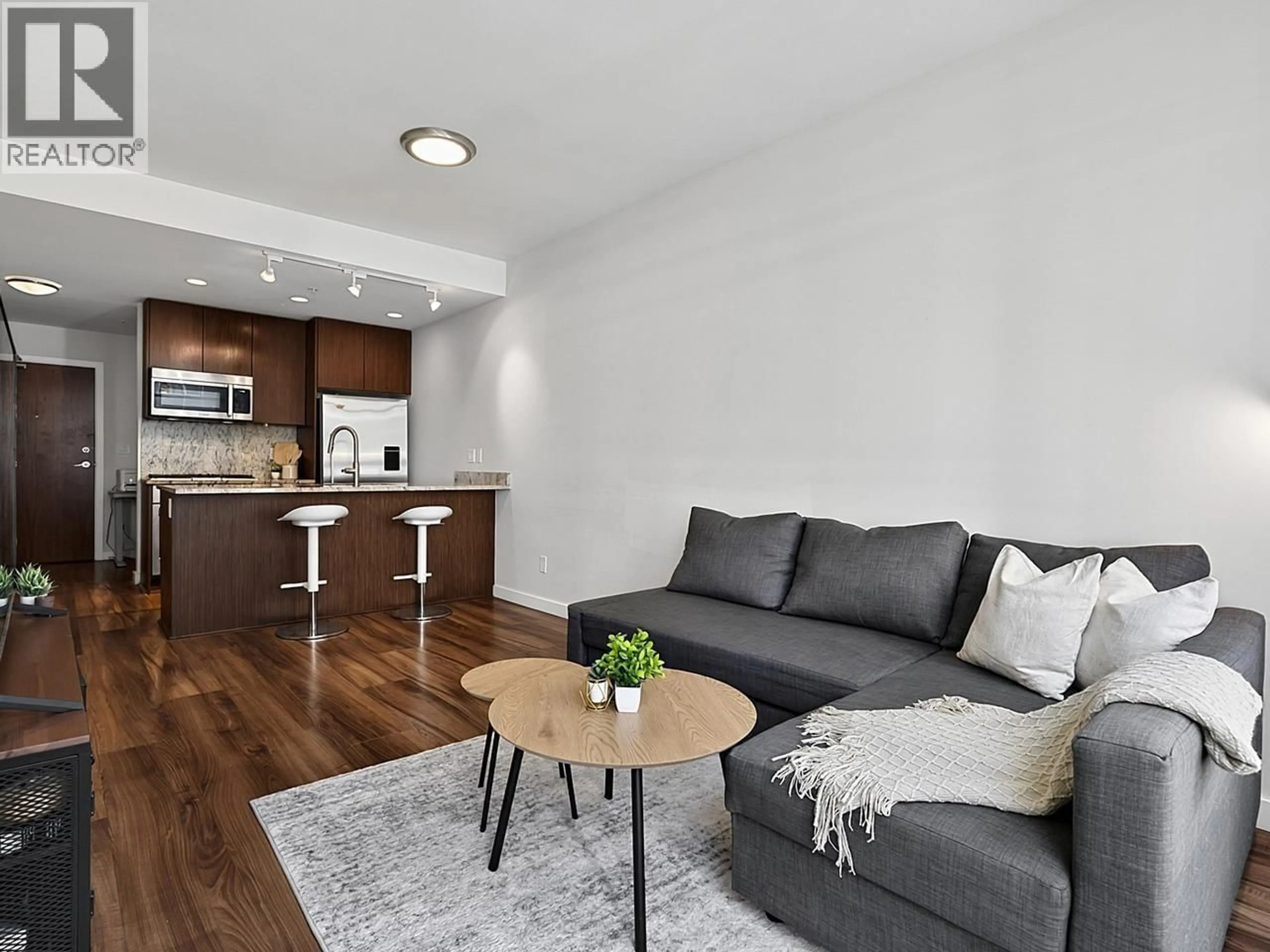 Living room with furniture, wood/laminate floor for 510 - 8628 HAZELBRIDGE WAY, Richmond British Columbia V6X0R5