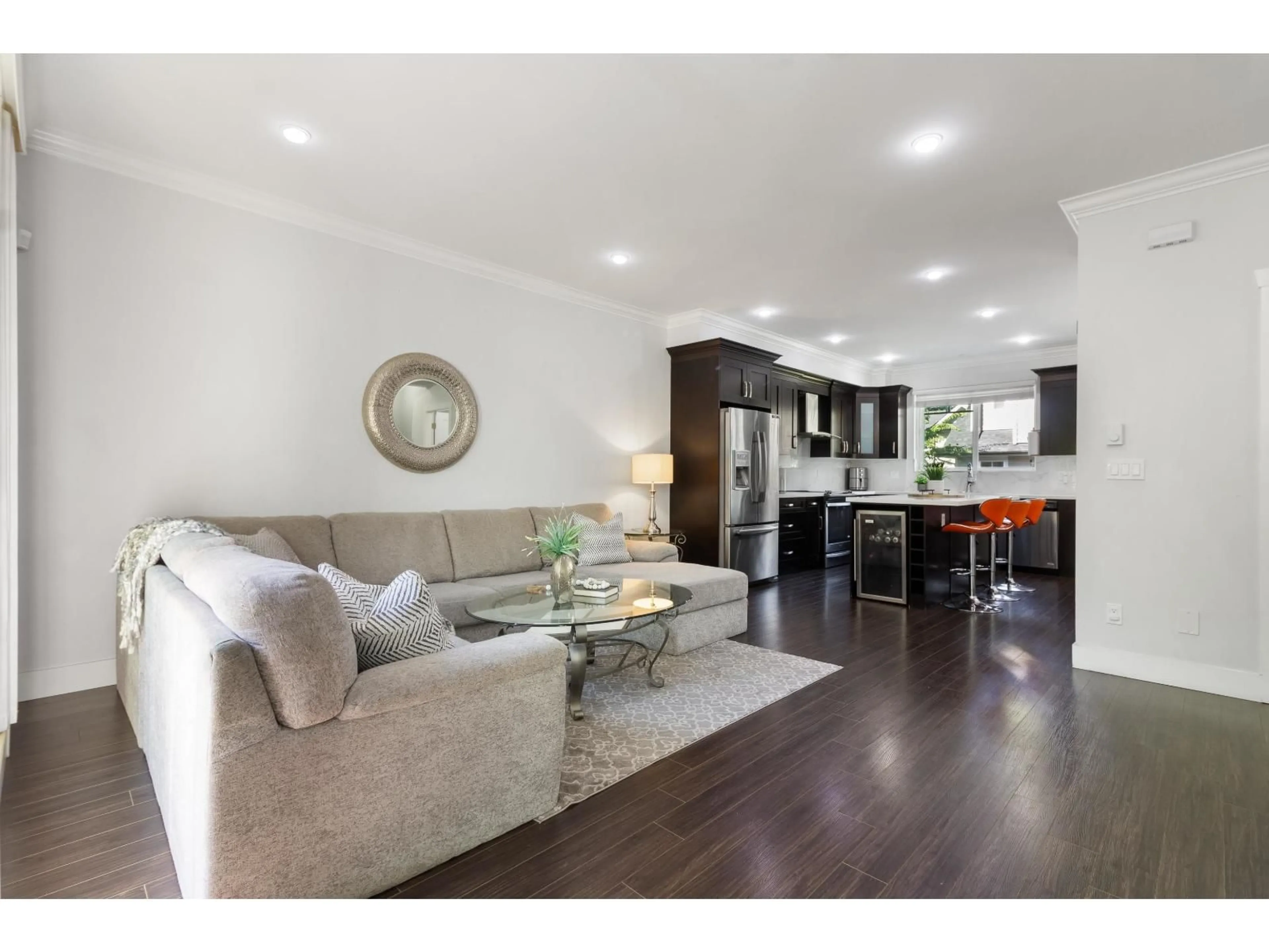Living room with furniture, wood/laminate floor for 10 - 14285 64 AVENUE, Surrey British Columbia V3W1Z2
