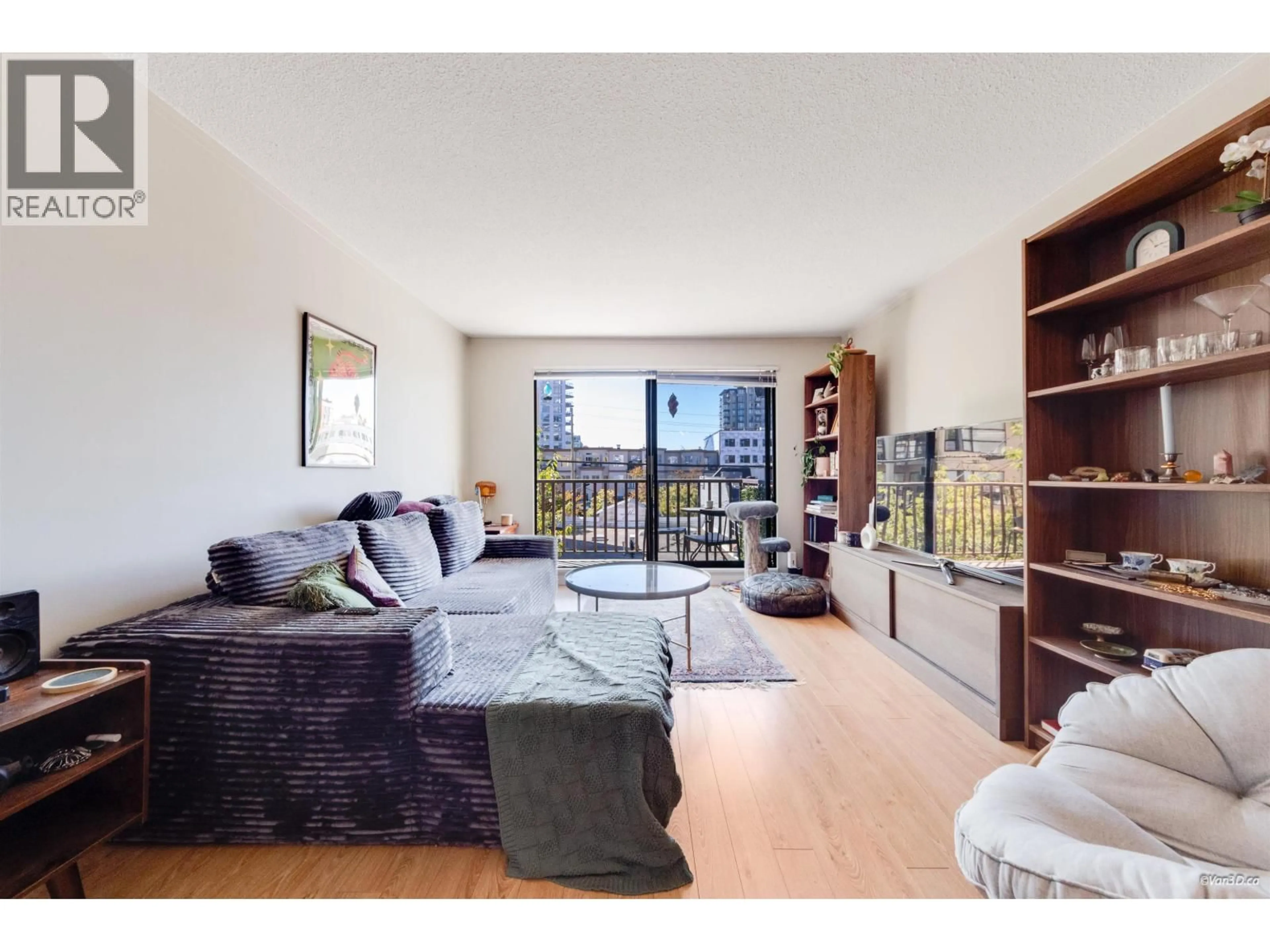 Living room with furniture, wood/laminate floor for 107 - 131 4TH STREET, North Vancouver British Columbia V7M3C8