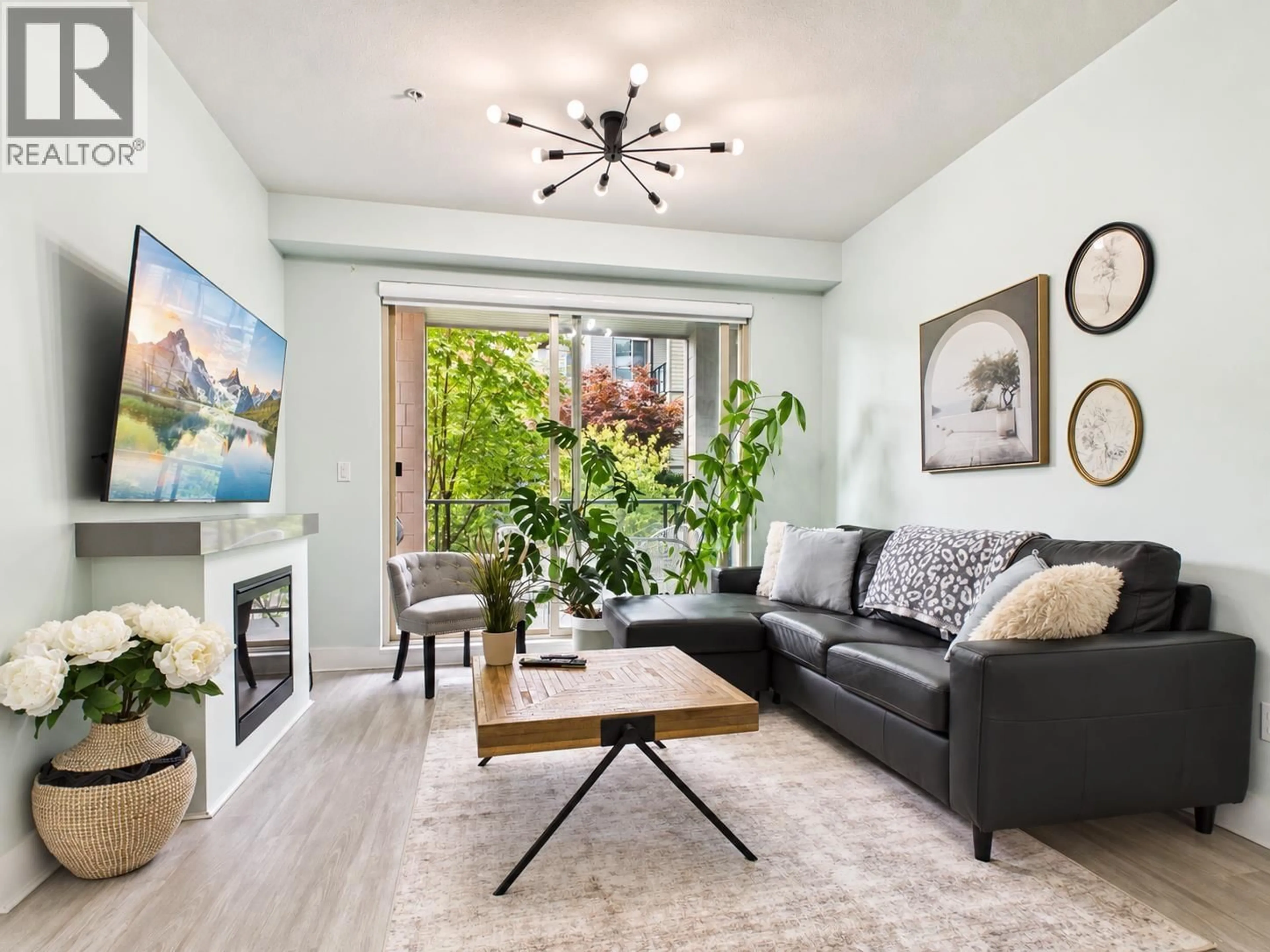 Living room with furniture, wood/laminate floor for 204 - 7428 BYRNEPARK, Burnaby British Columbia V3N0B4