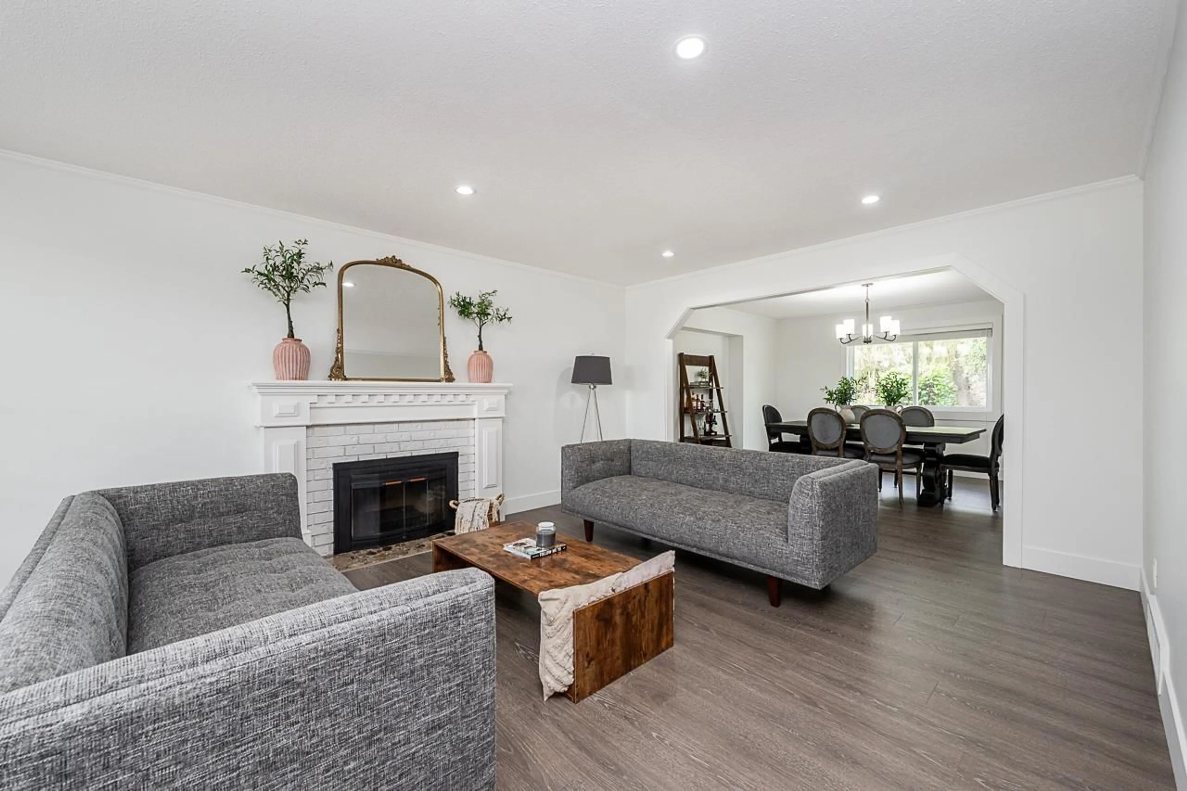 Living room with furniture, wood/laminate floor for 18875 57 AVENUE, Surrey British Columbia V3S7M4