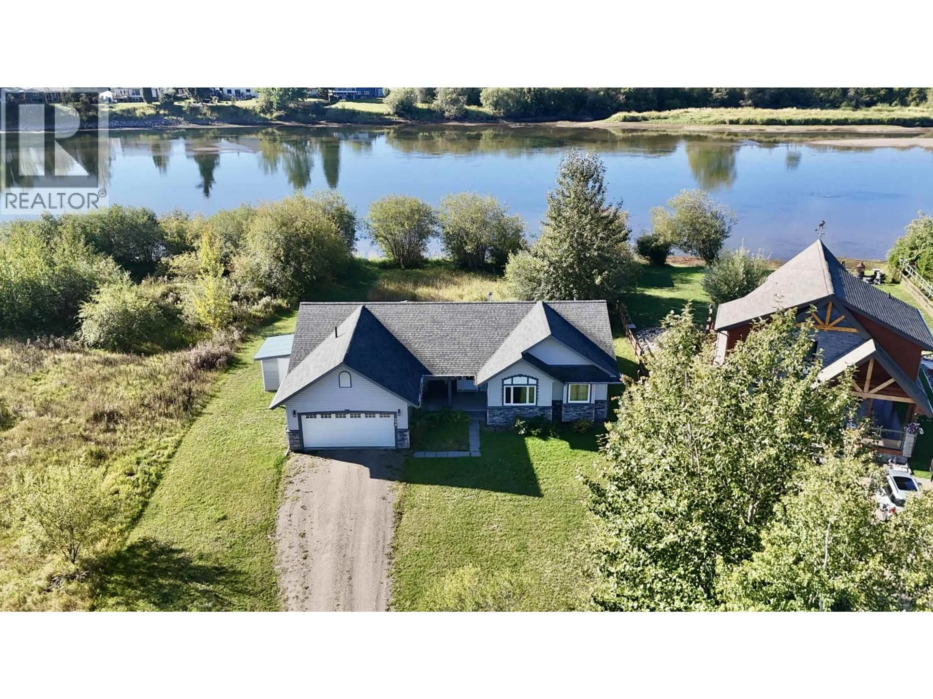 A pic from outside/outdoor area/front of a property/back of a property/a pic from drone, water/lake/river/ocean view for 608 REID DRIVE, Vanderhoof British Columbia V0J3A2