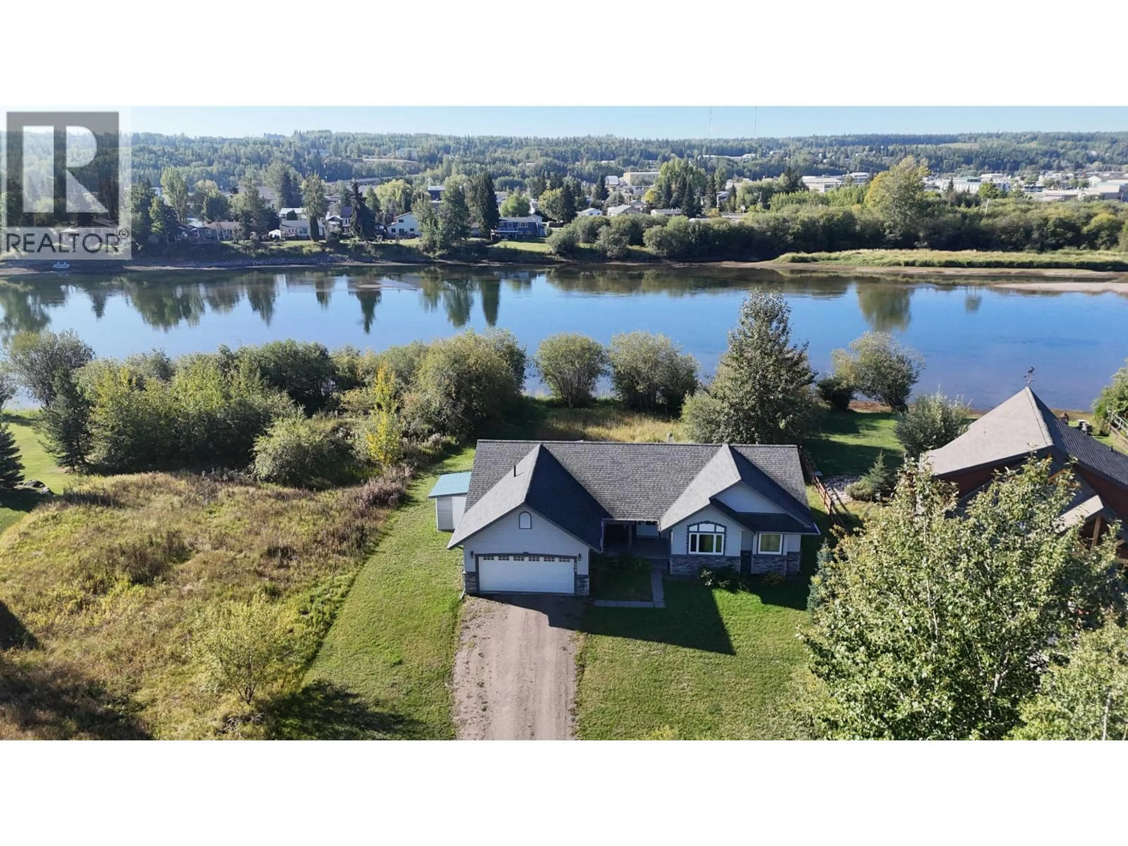 A pic from outside/outdoor area/front of a property/back of a property/a pic from drone, water/lake/river/ocean view for 608 REID DRIVE, Vanderhoof British Columbia V0J3A2
