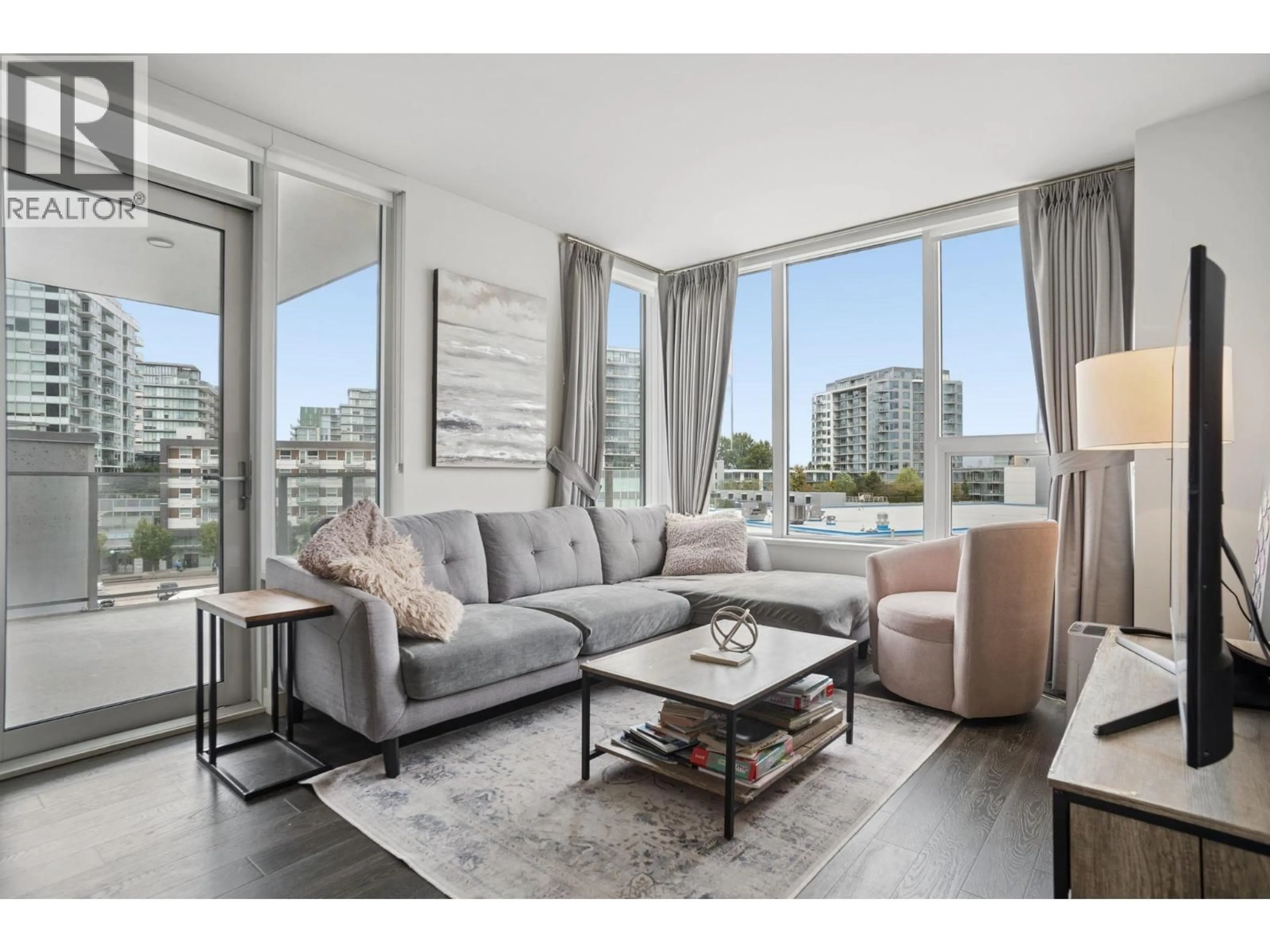 Living room with furniture, wood/laminate floor for 608 - 7488 LANSDOWNE ROAD, Richmond British Columbia V7C0B9