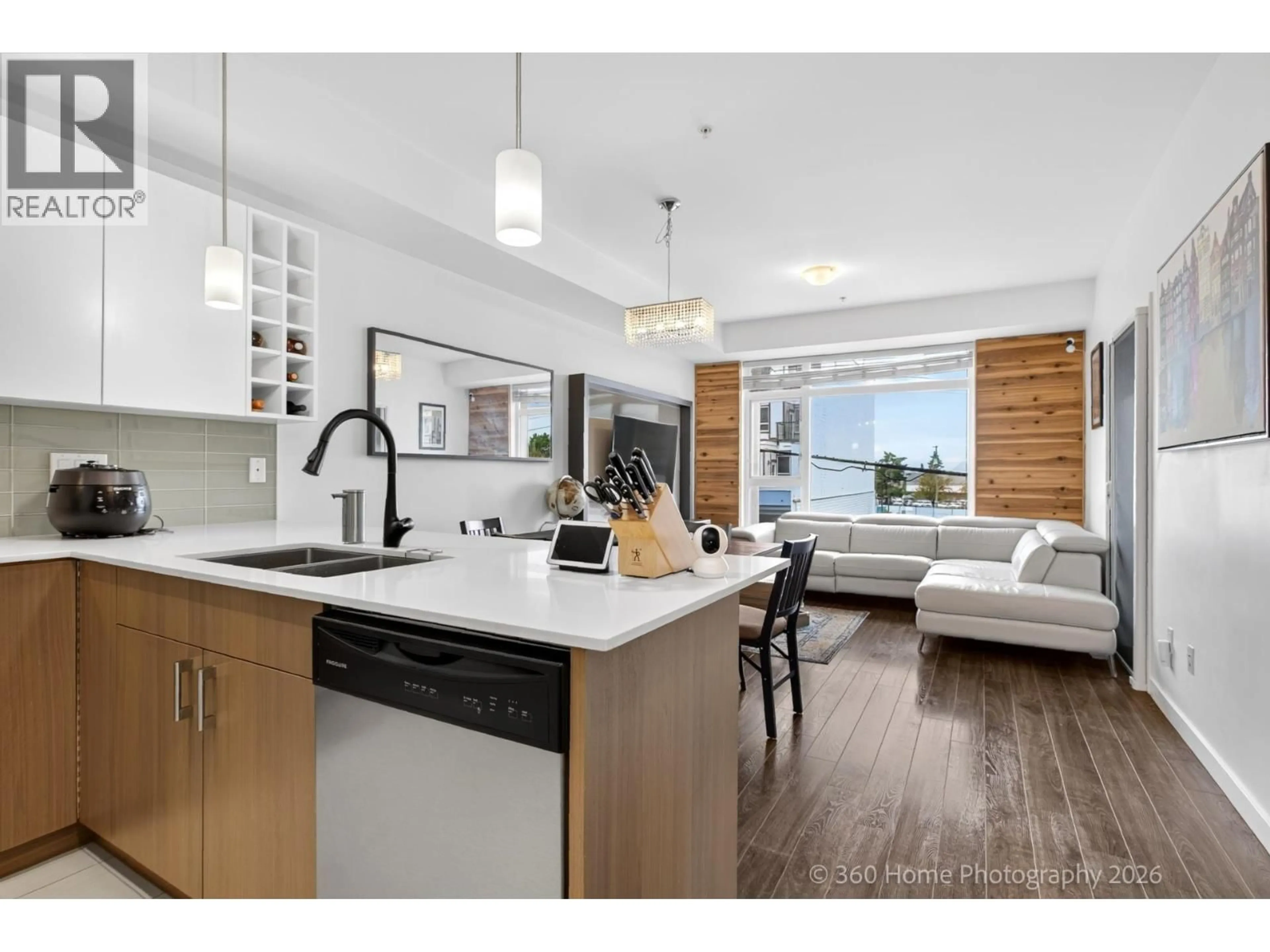 Open concept kitchen, wood/laminate floor for 202 - 5288 GRIMMER STREET, Burnaby British Columbia V5H0C5