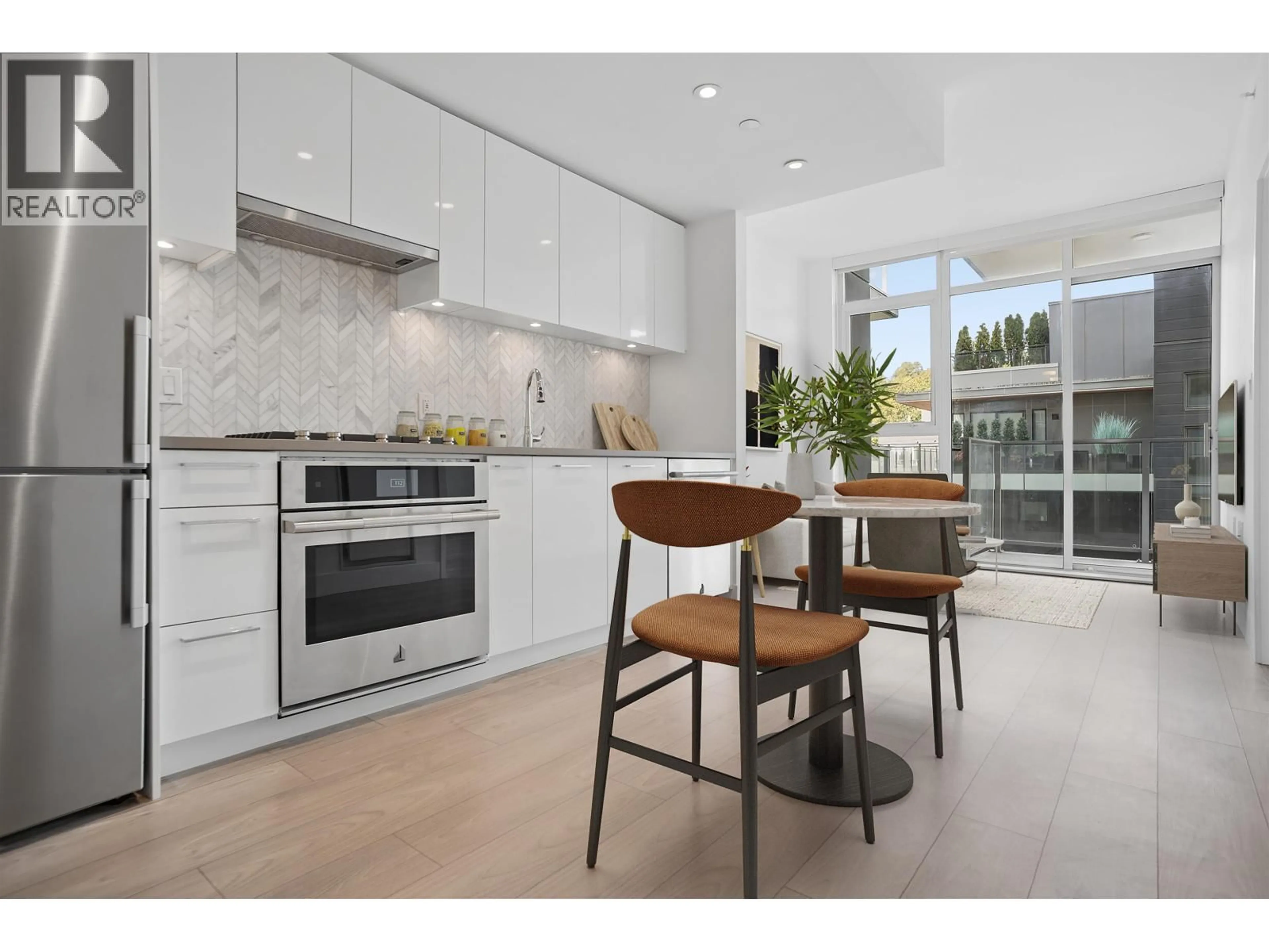 Open concept kitchen, ceramic/tile floor for 602 - 3581 KENT AVENUE NORTH, Vancouver British Columbia V5S0H6