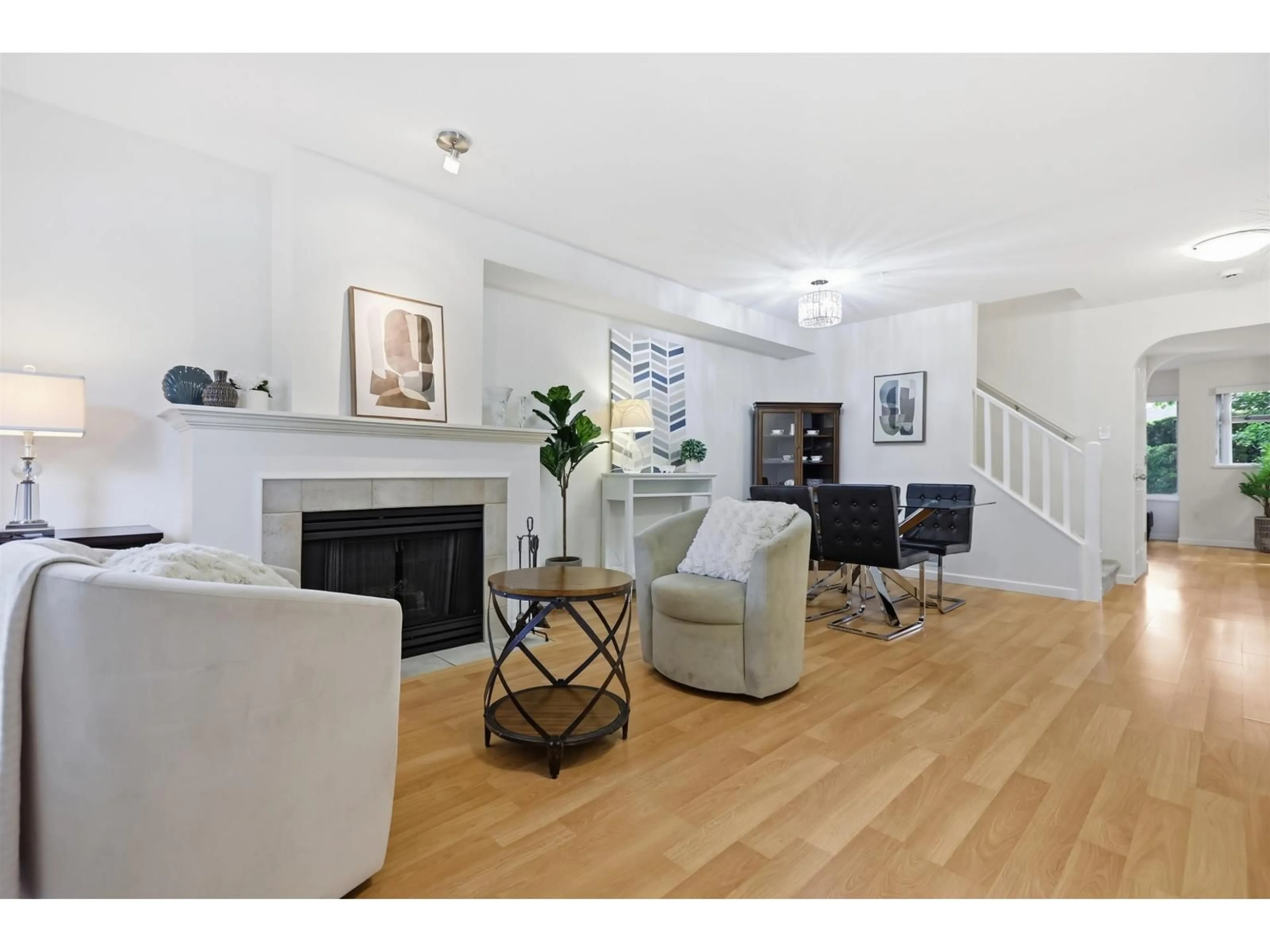 Living room with furniture, wood/laminate floor for 6 - 18883 65 AVENUE, Surrey British Columbia V3S8Y2