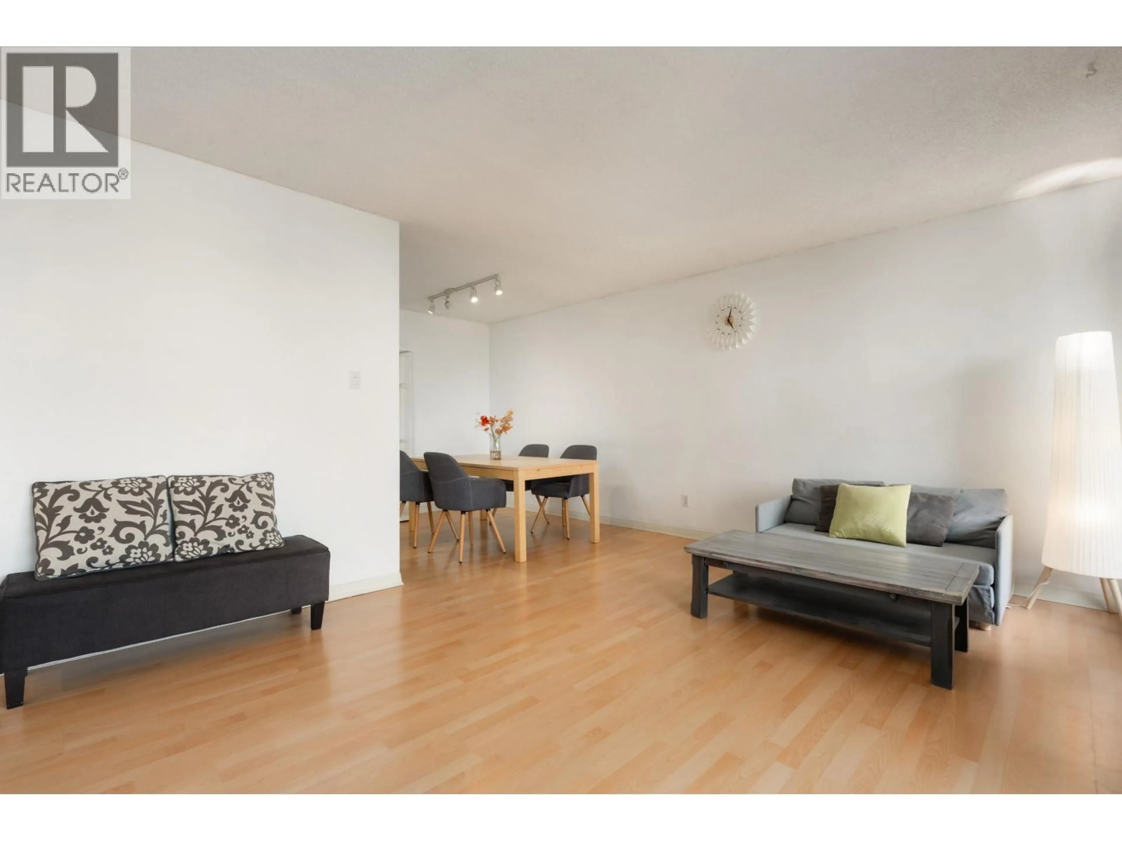 Living room with furniture, wood/laminate floor for 704 - 6689 WILLINGDON AVENUE, Burnaby British Columbia V5H3Y8