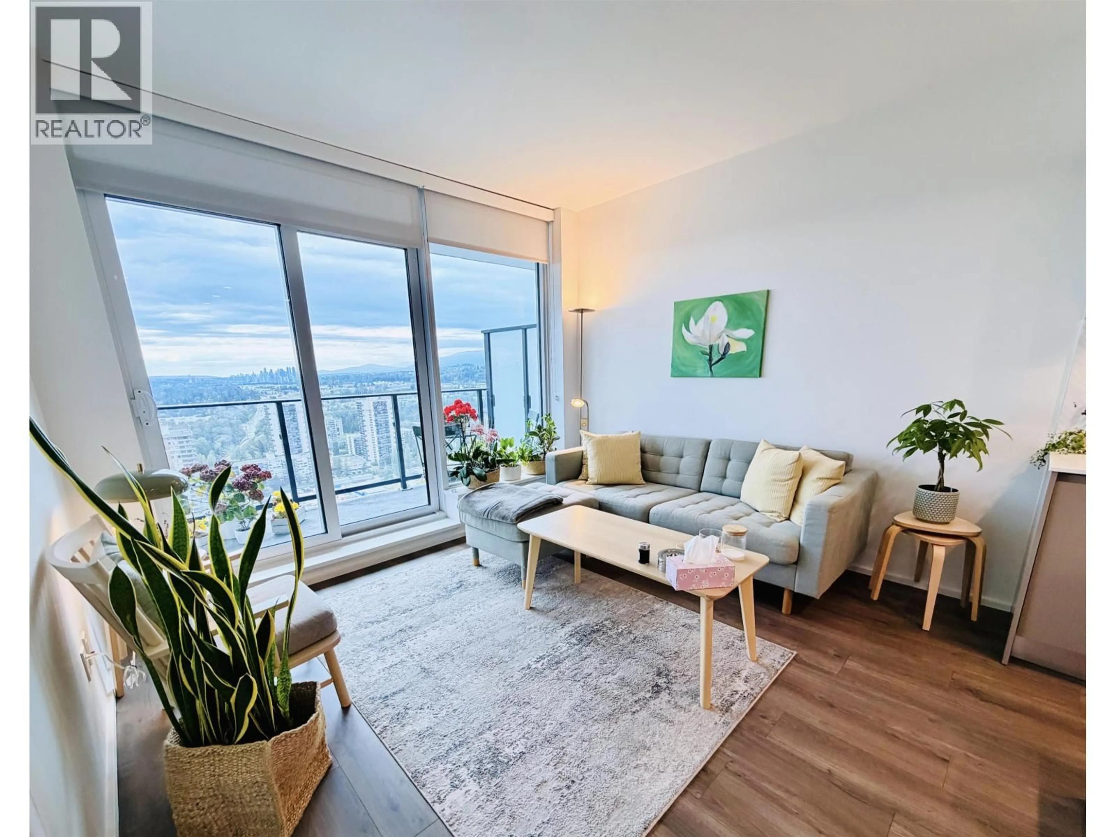 Living room with furniture, wood/laminate floor for 2909 - 3809 EVERGREEN PLACE, Burnaby British Columbia V3J0M1