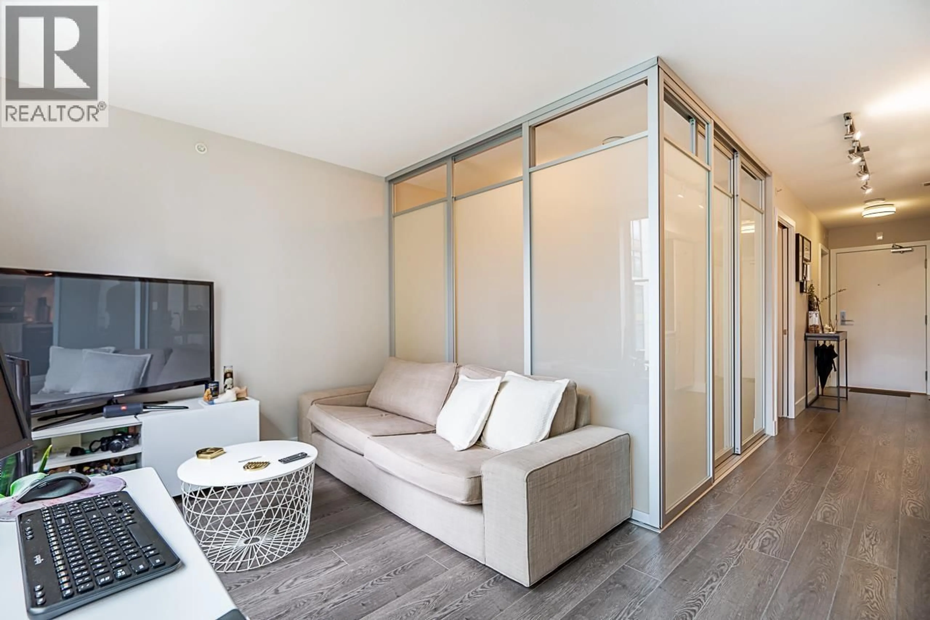 Living room with furniture, wood/laminate floor for 524 - 1783 MANITOBA STREET, Vancouver British Columbia V5Y0K1